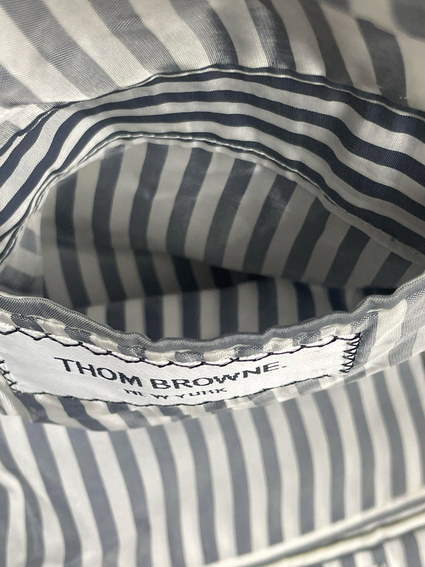 Thom Browne New York woven brand label on grey ropestripe blazer