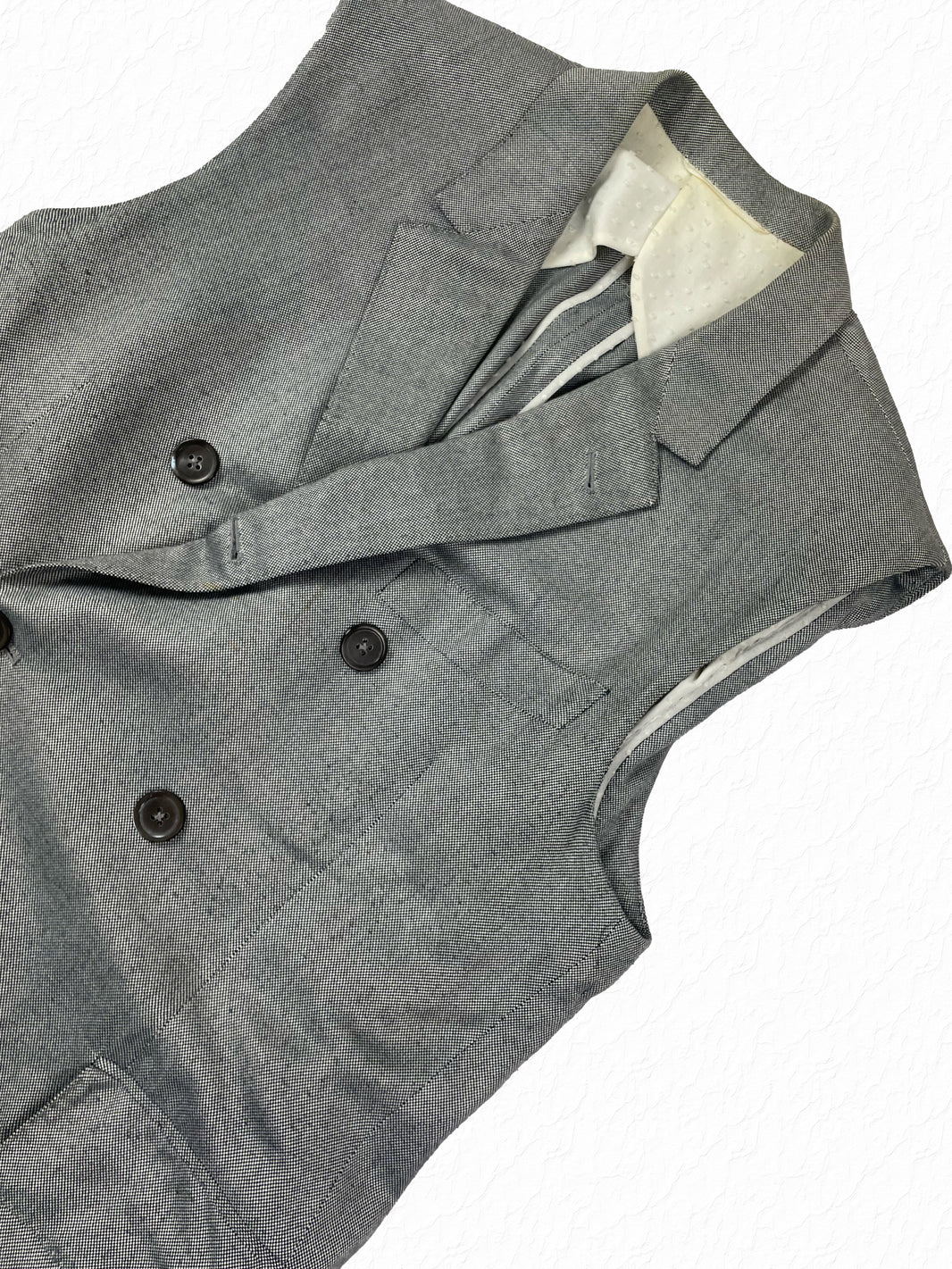 Black and white pepper cotton Thom Browne sleeveless chesterfield with peak lapels