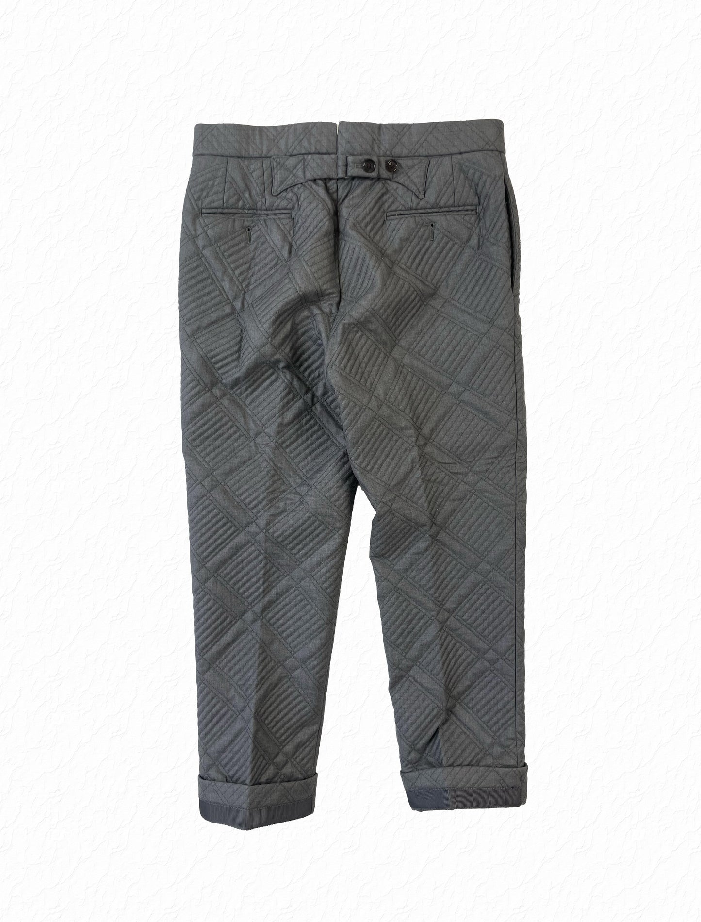 Cropped grosgrain cuffs on Thom Browne grey quilted wool trousers