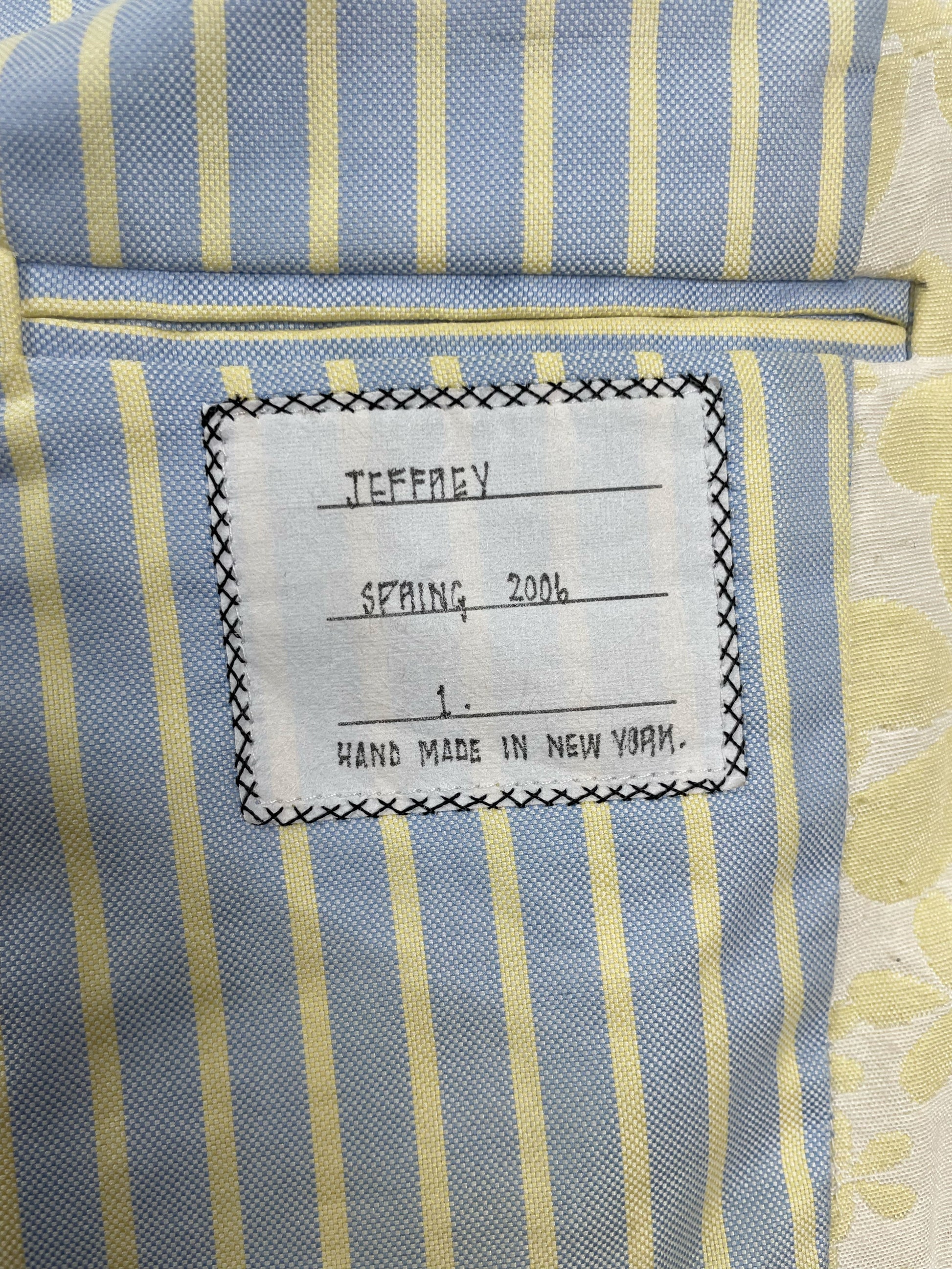 Blue and yellow striped oxford lining on Thom Browne sport coat