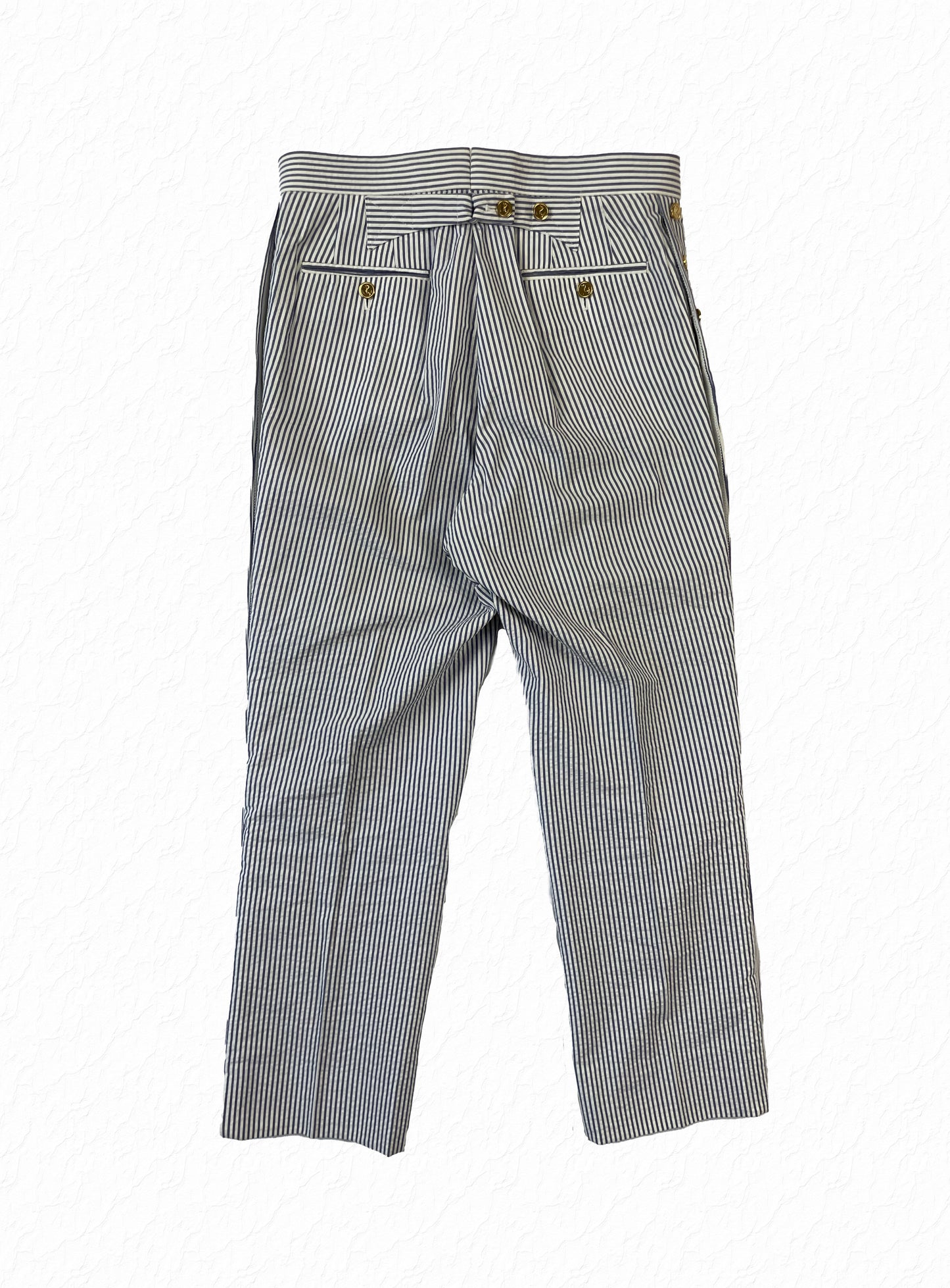 Gold anchor button fly on Thom Browne seersucker striped pants