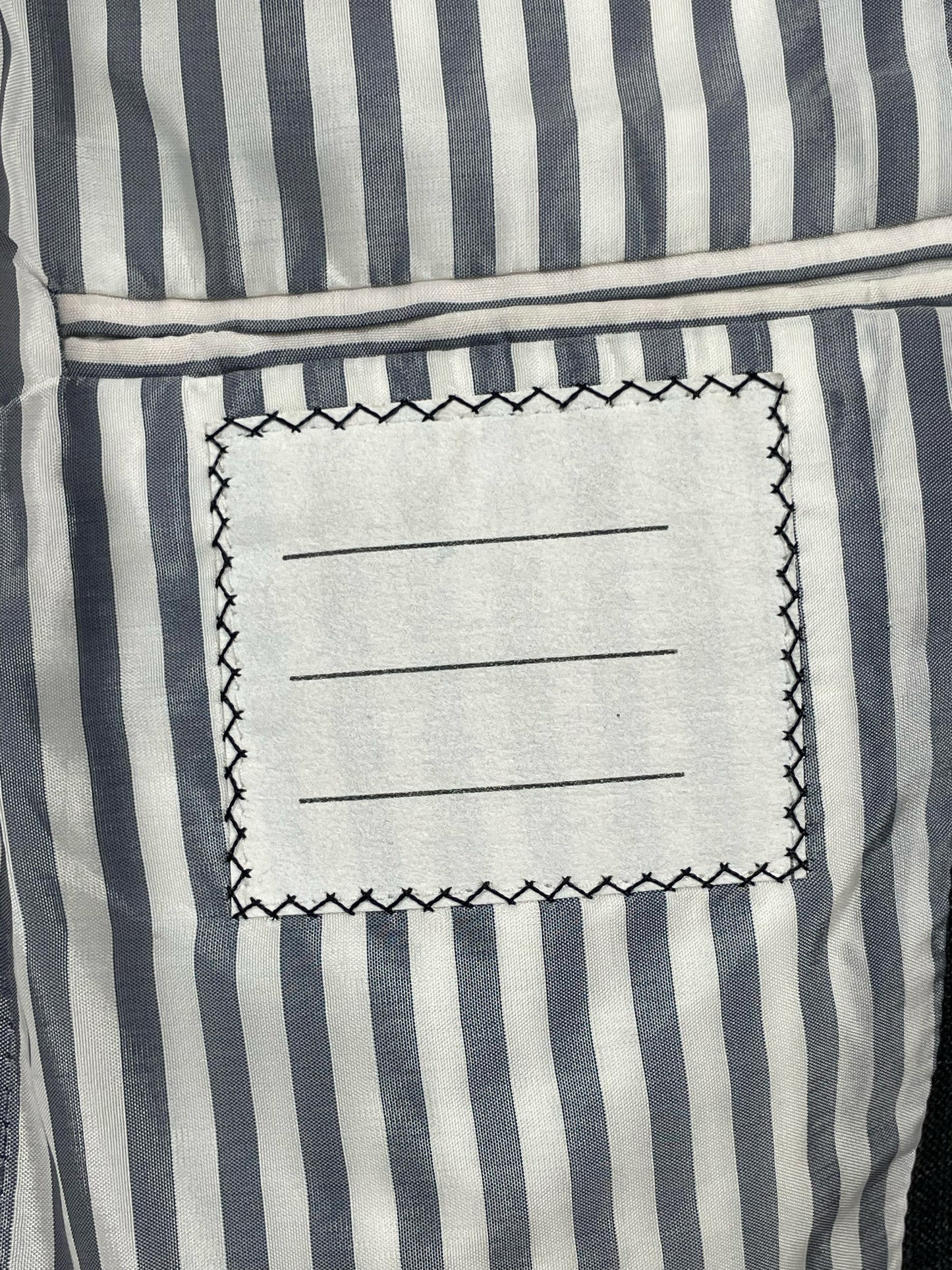 Striped interior label on Thom Browne Spring 2008 wool sport coat