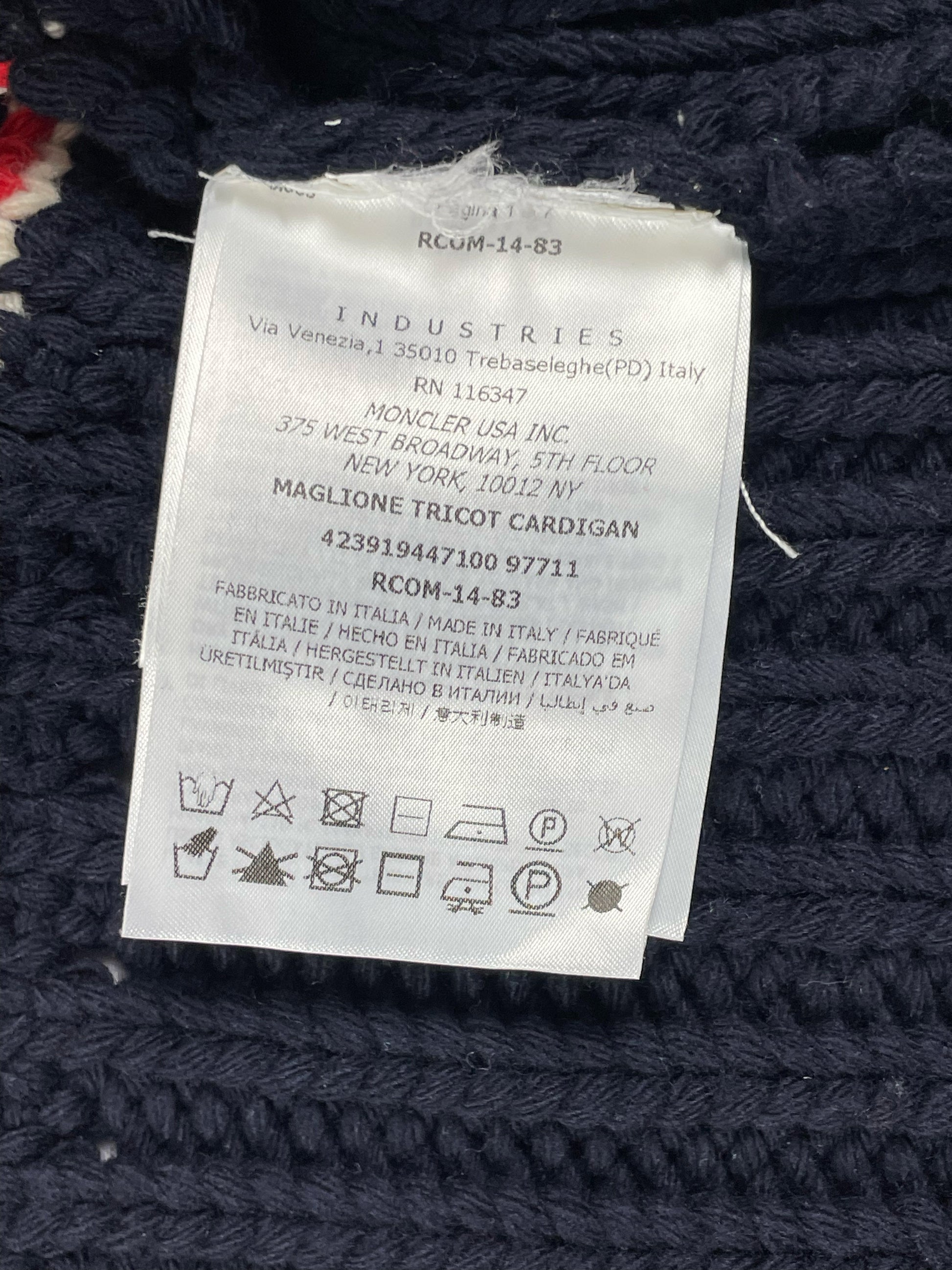 Gold logo buttons on the Moncler Gamme Bleu argyle wool cardigan