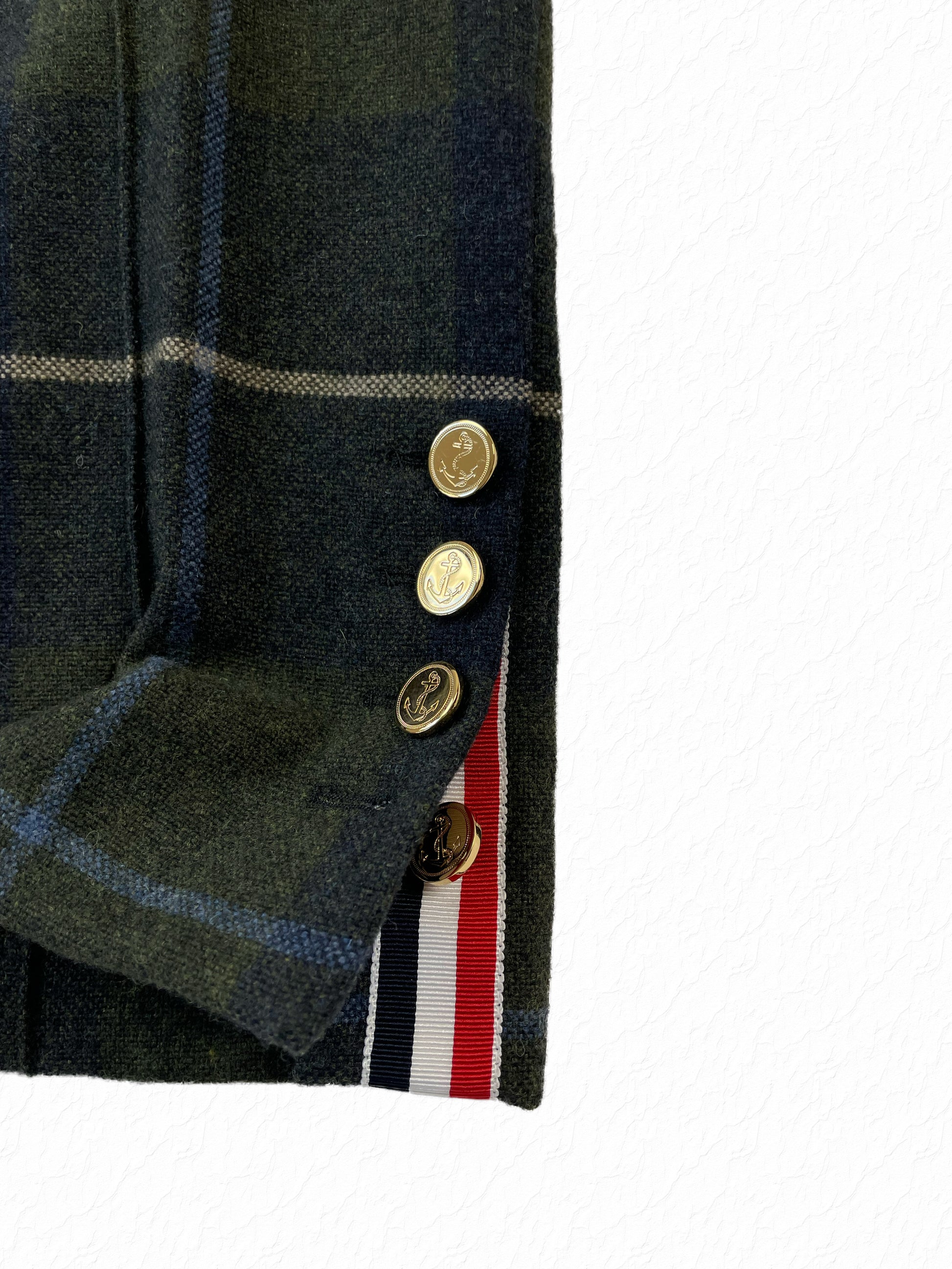Green and navy tartan wool trousers with anchor buttons by Thom Browne