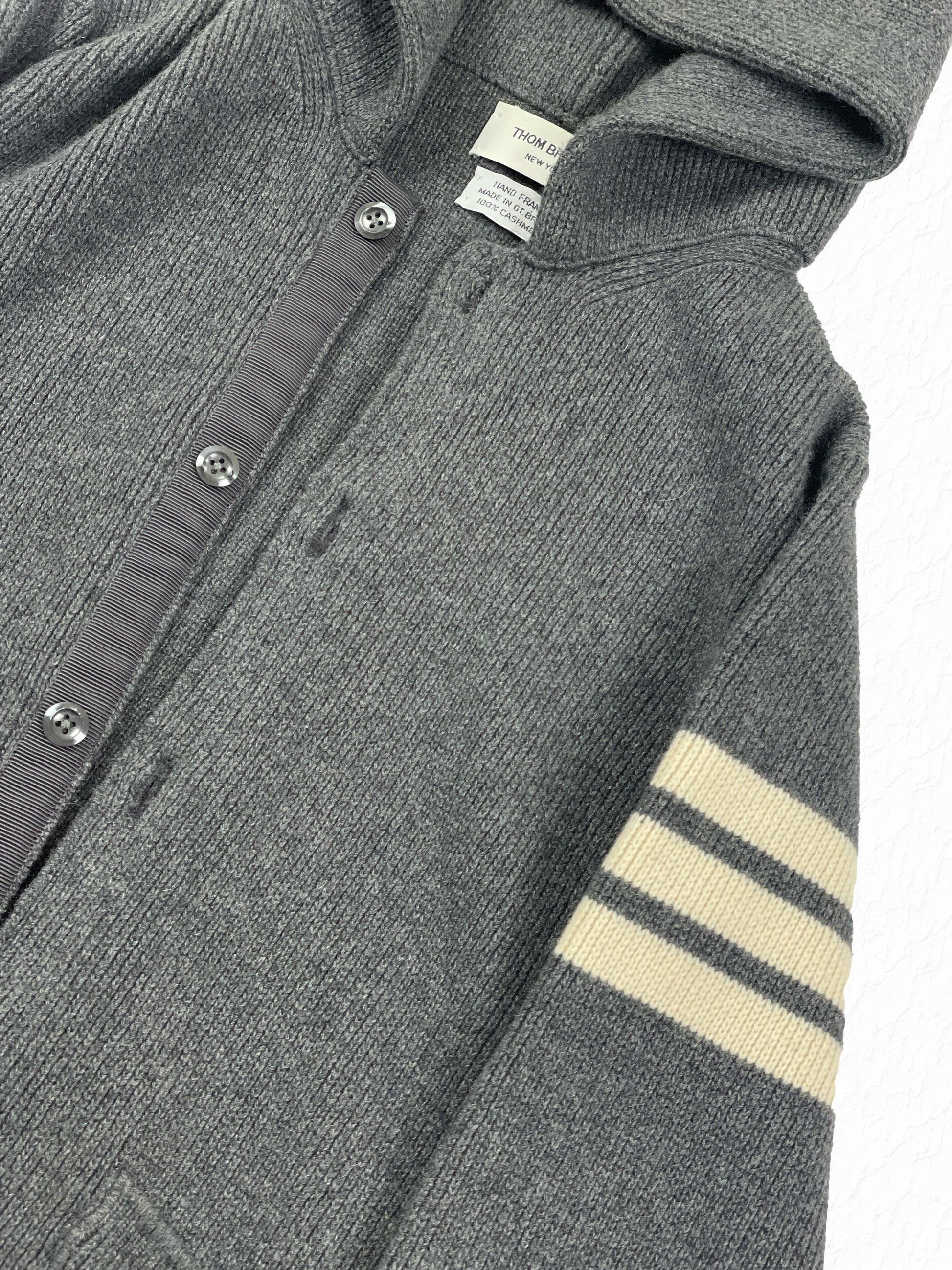 Cream 4-bar sleeve stripe on Thom Browne grey cashmere hooded cardigan