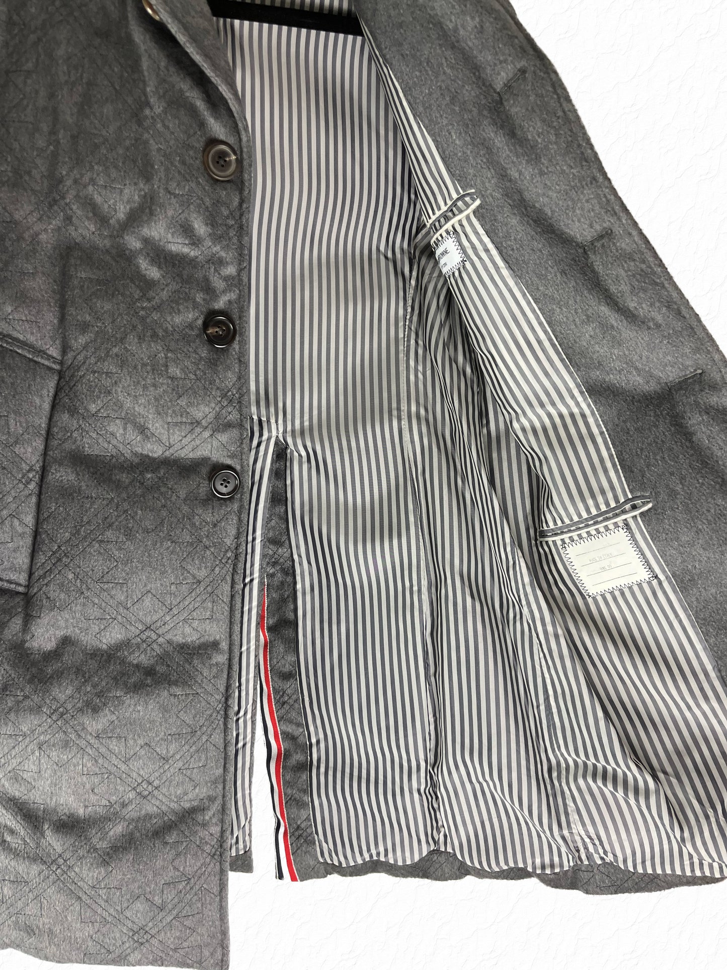 Zibeline stormproof quilted padding on Thom Browne Chesterfield coat