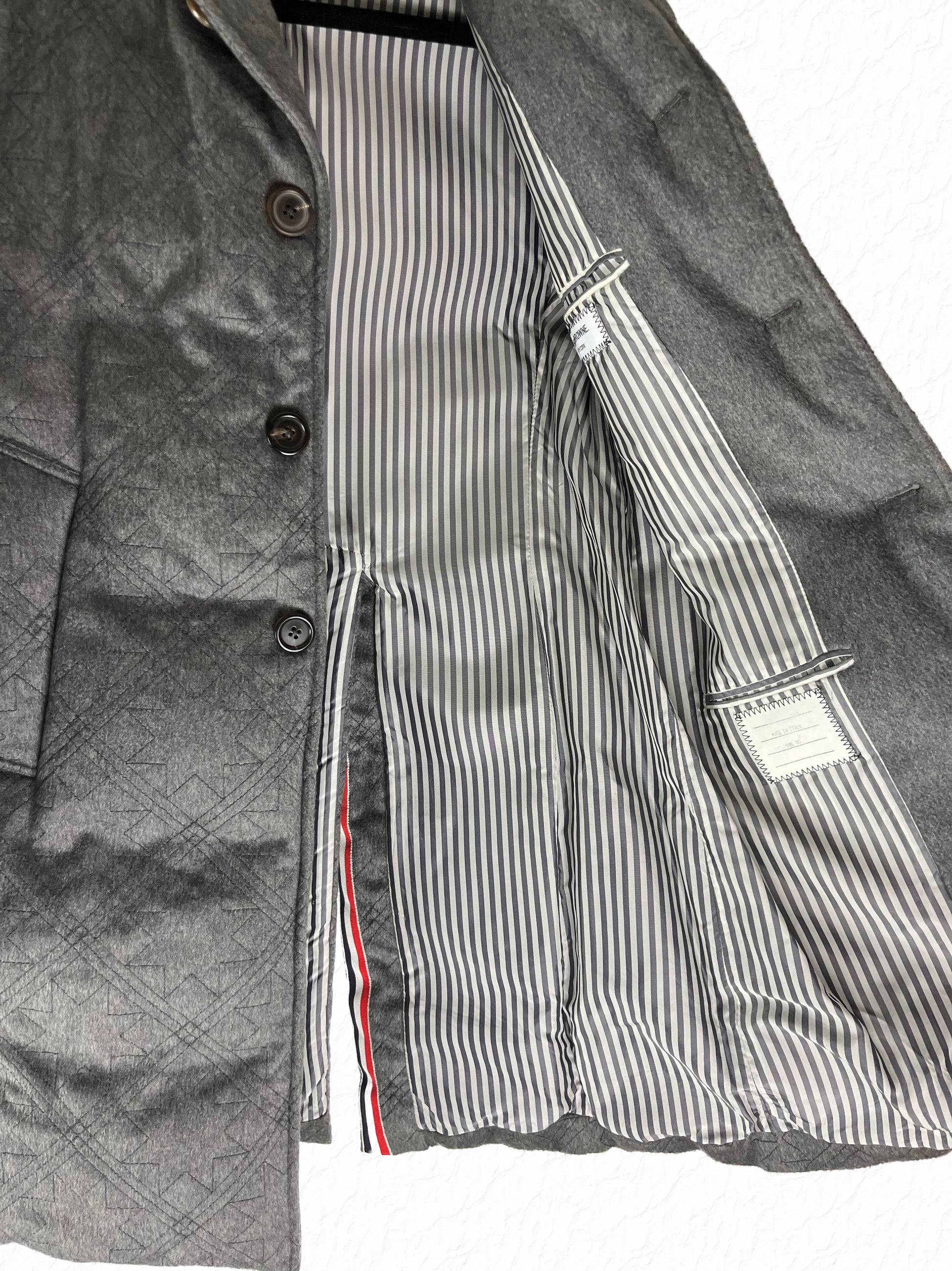 Zibeline stormproof quilted padding on Thom Browne Chesterfield coat
