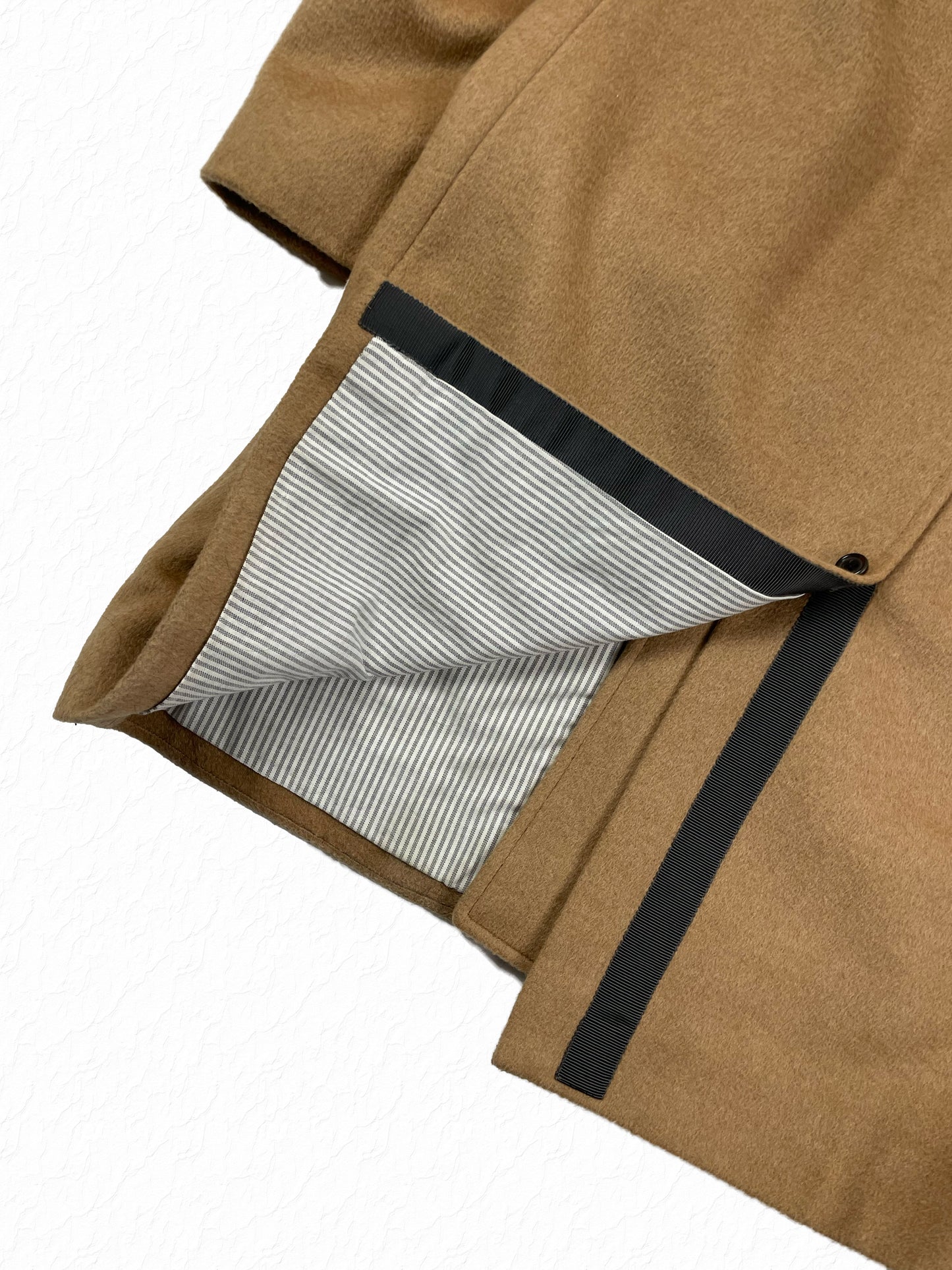 Grosgrain trimmed hem on Thom Browne camel hair car coat