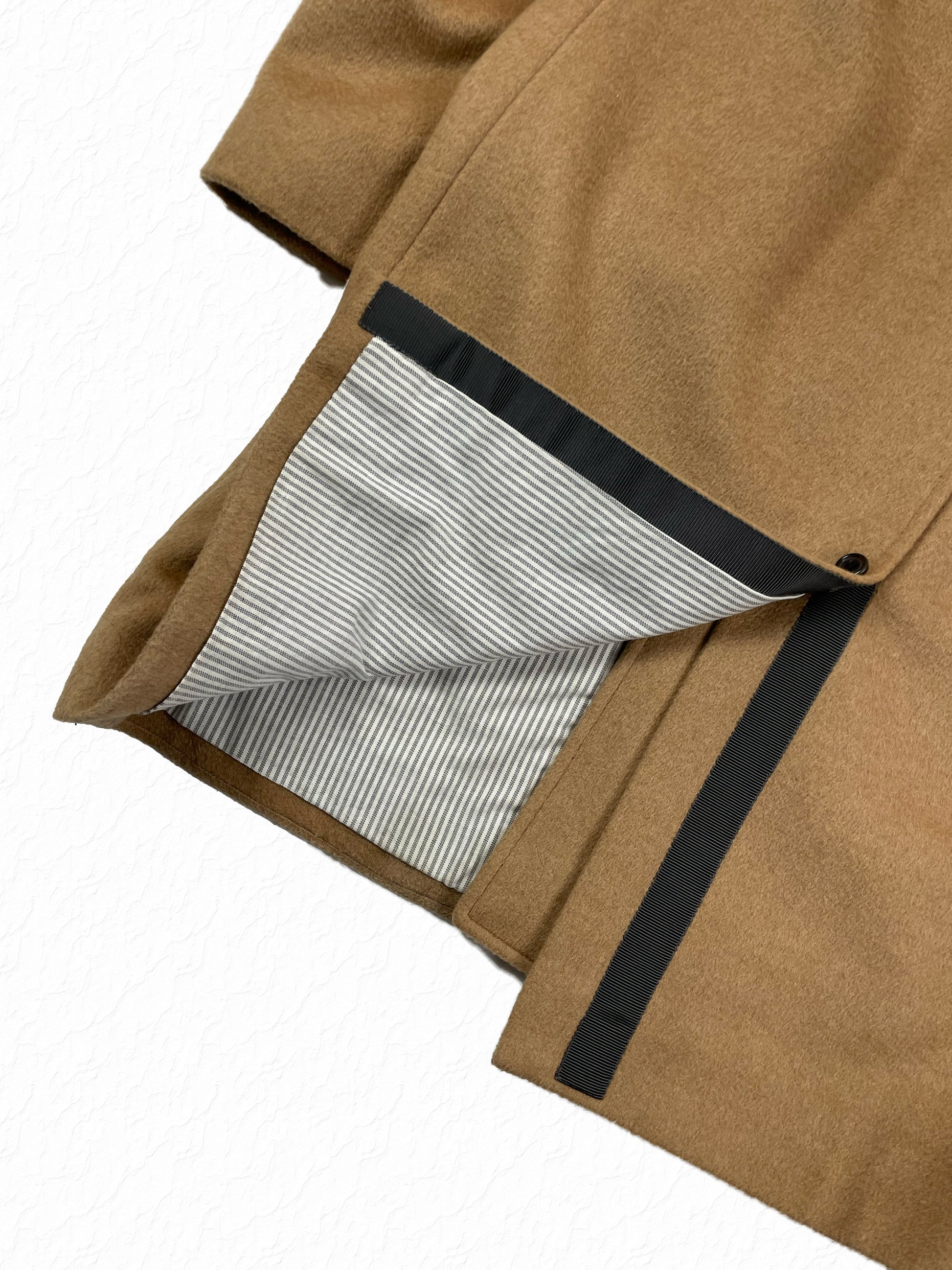 Grosgrain trimmed hem on Thom Browne camel hair car coat