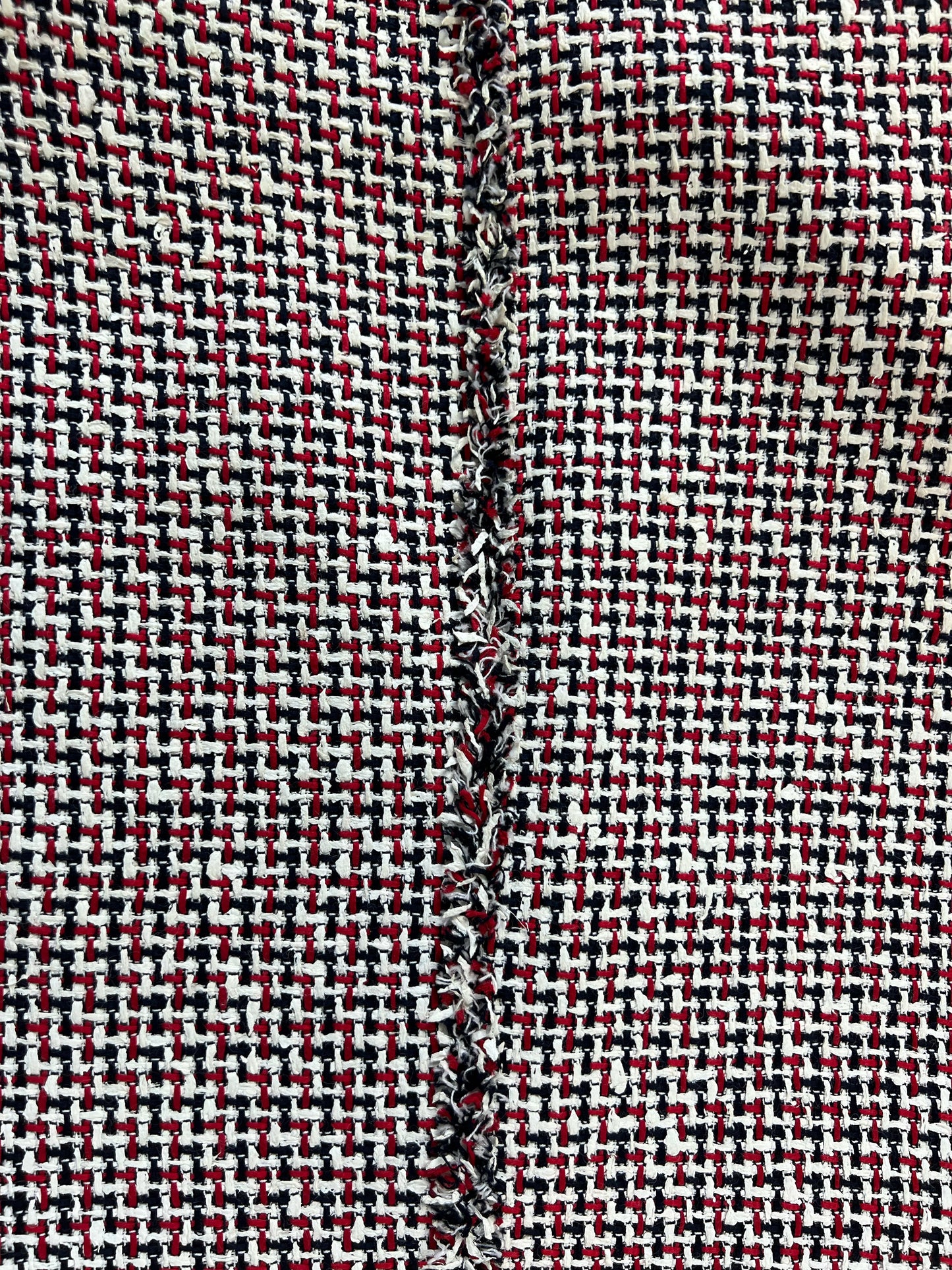 Woven red white navy houndstooth tweed texture of Thom Browne jacket
