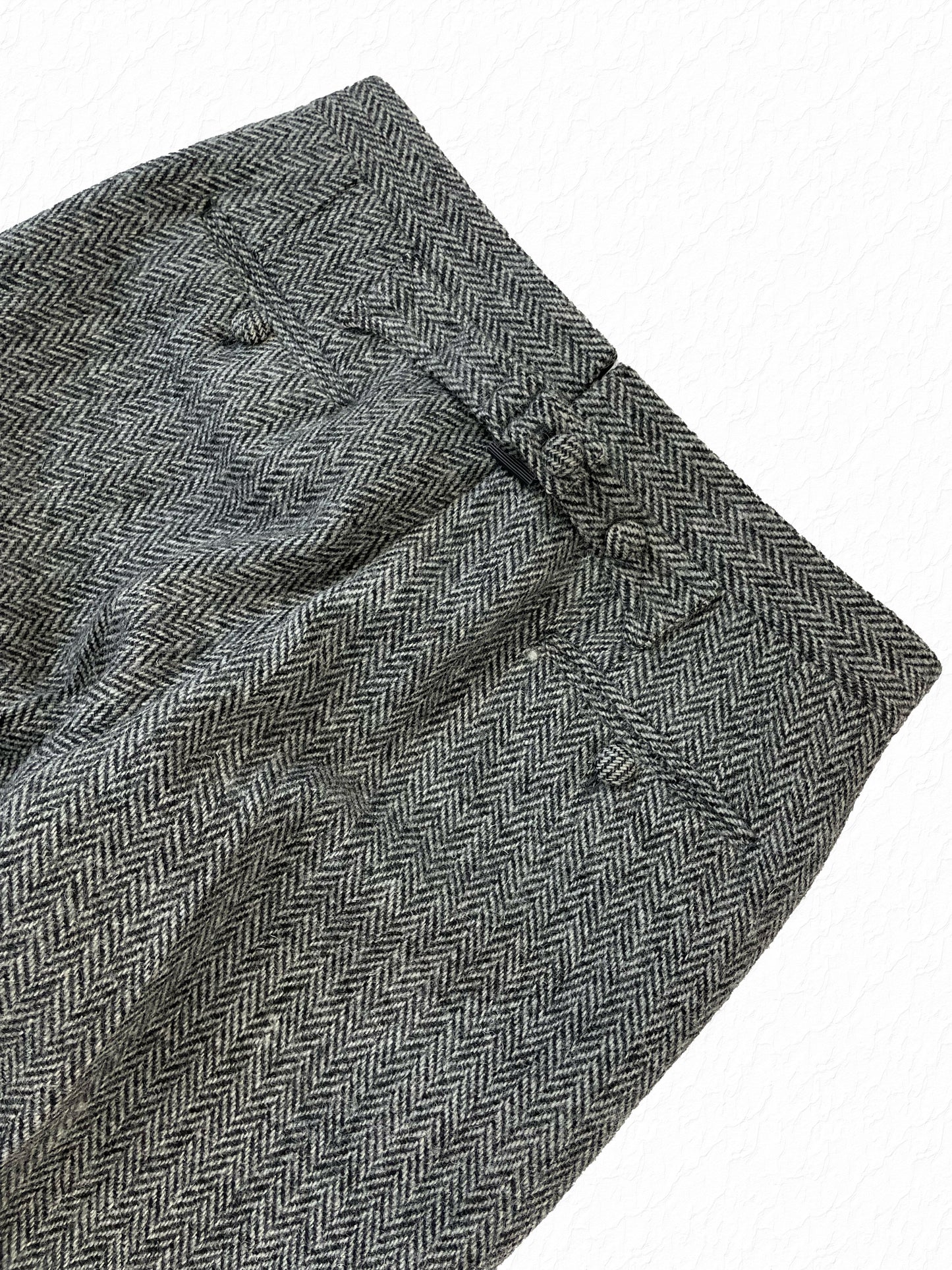 Cuffed hem on Thom Browne grey herringbone tweed trousers