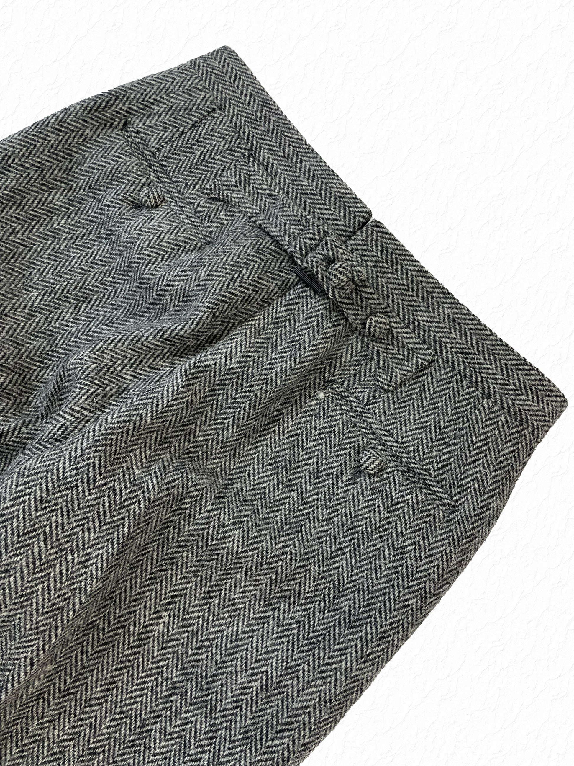 Cuffed hem on Thom Browne grey herringbone tweed trousers