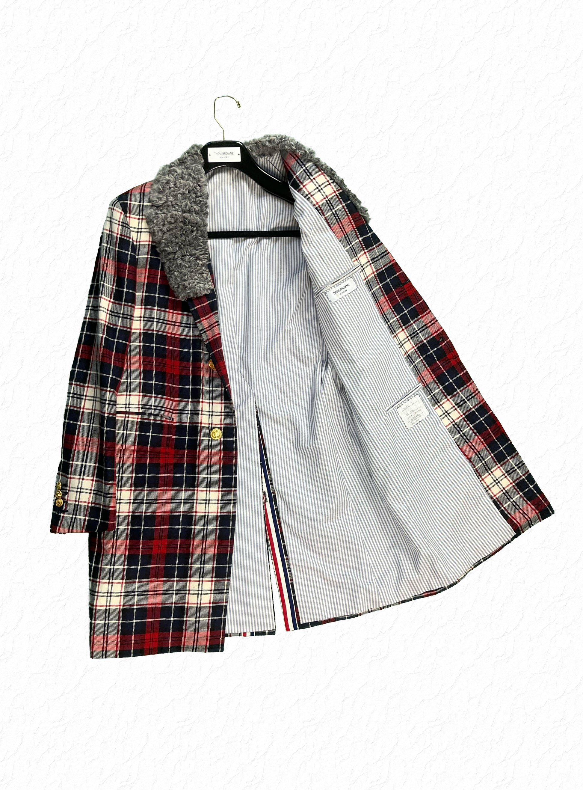 Grey astrakhan fur collar on Thom Browne Colette tartan Chesterfield coat