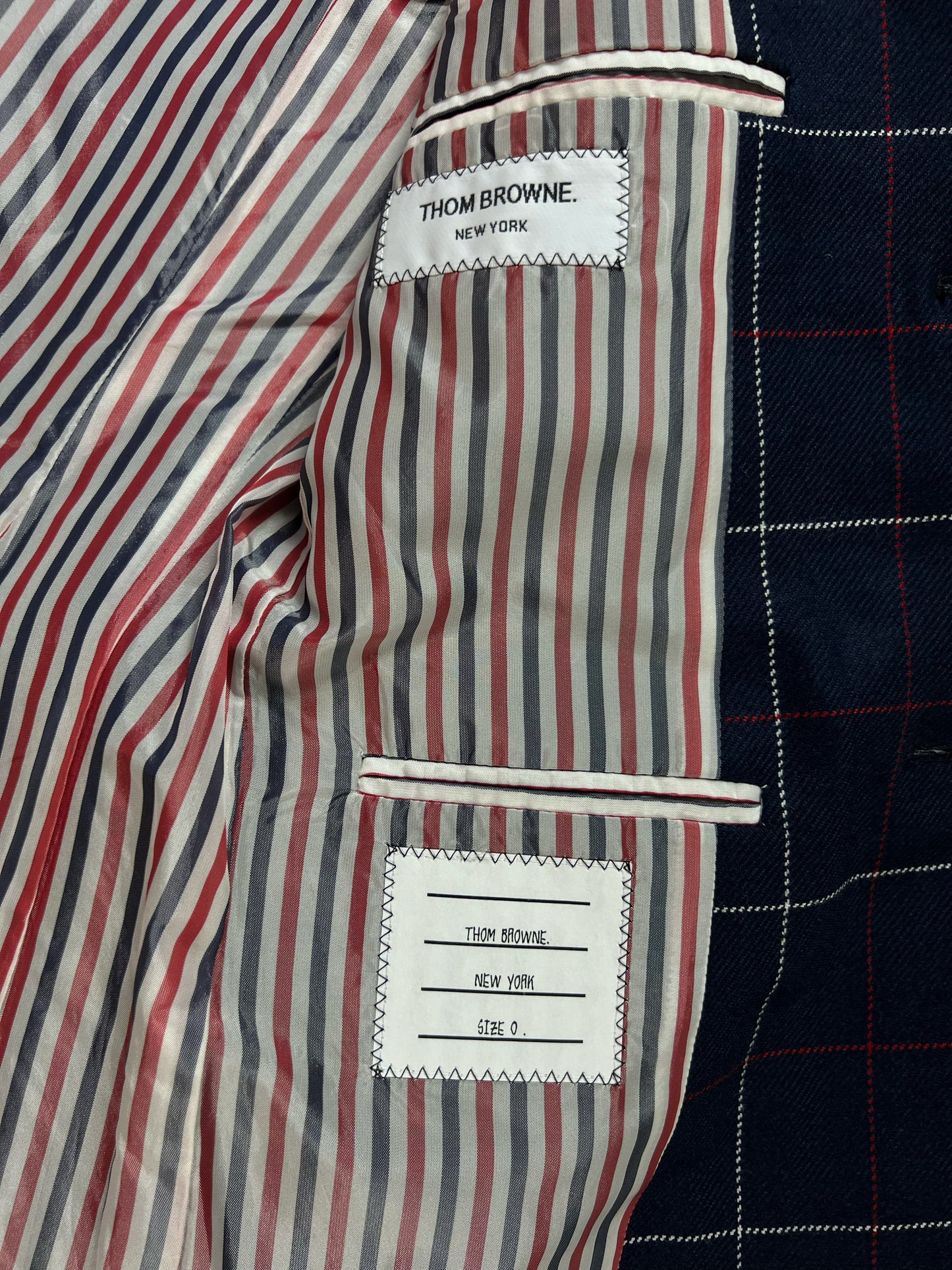 Tricolor striped satin lining inside Thom Browne navy windowpane flannel blazer
