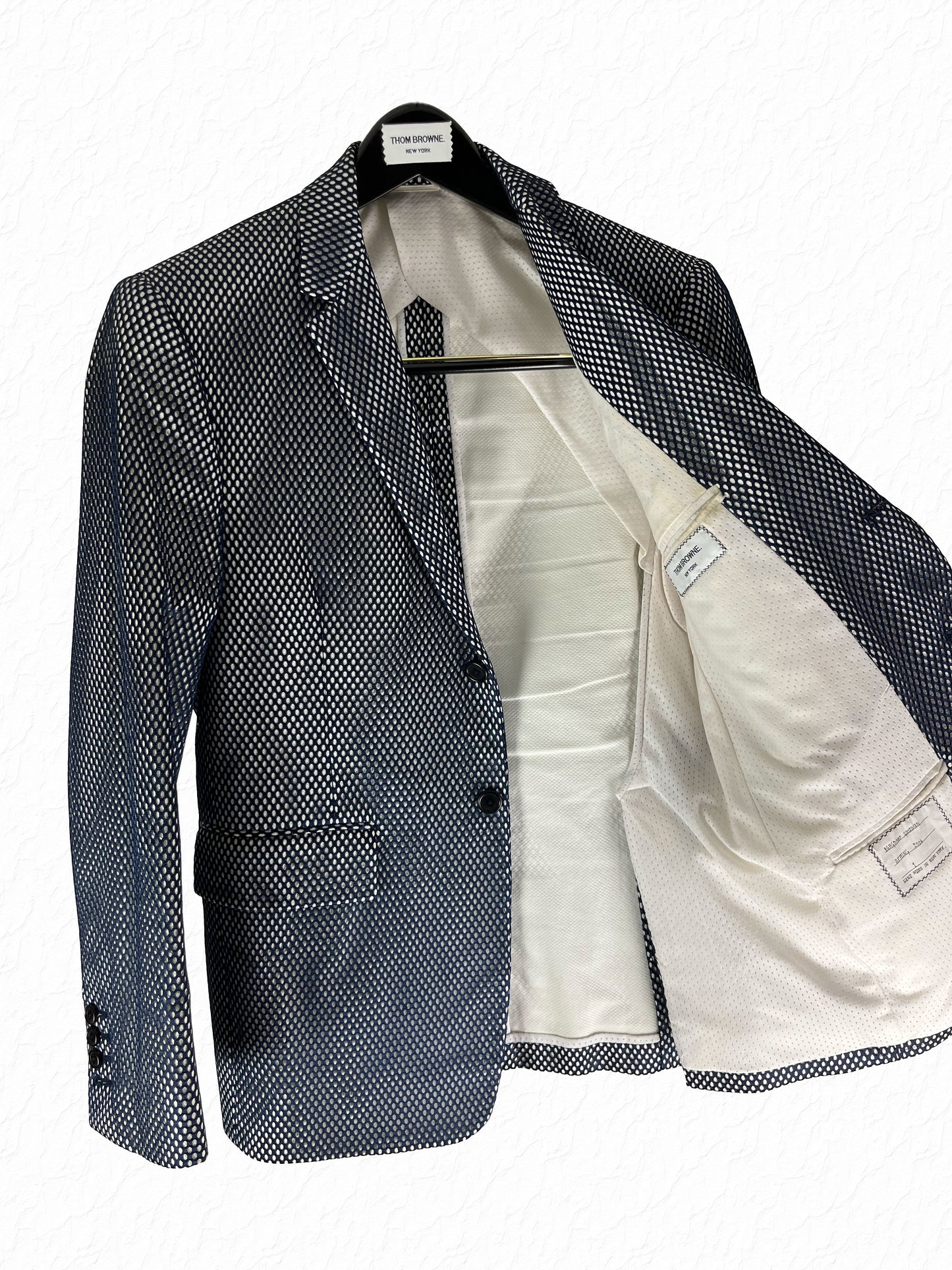 White cotton pique interior of Thom Browne Spring 2006 mesh Marcella jacket