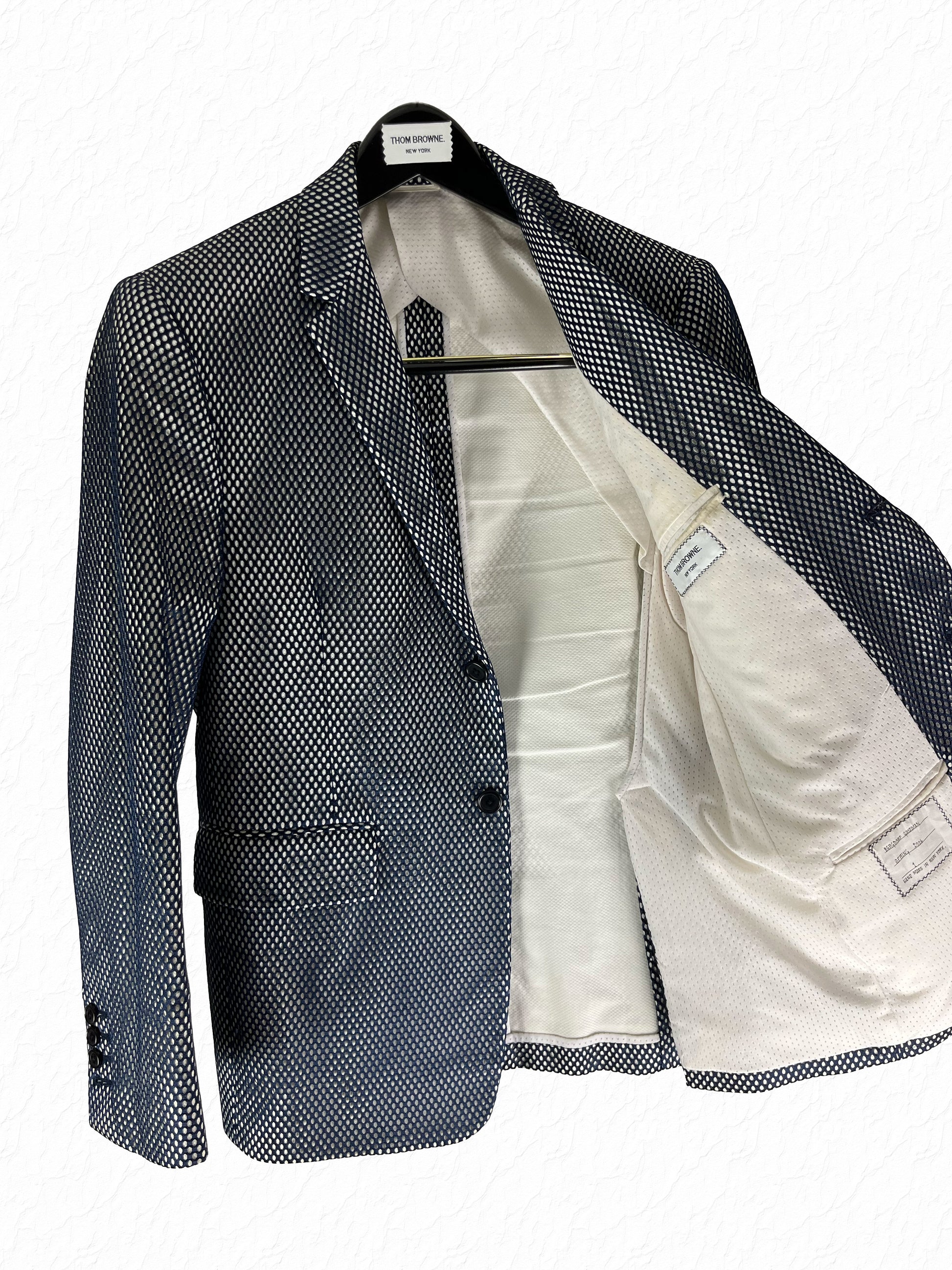 White cotton pique interior of Thom Browne Spring 2006 mesh Marcella jacket