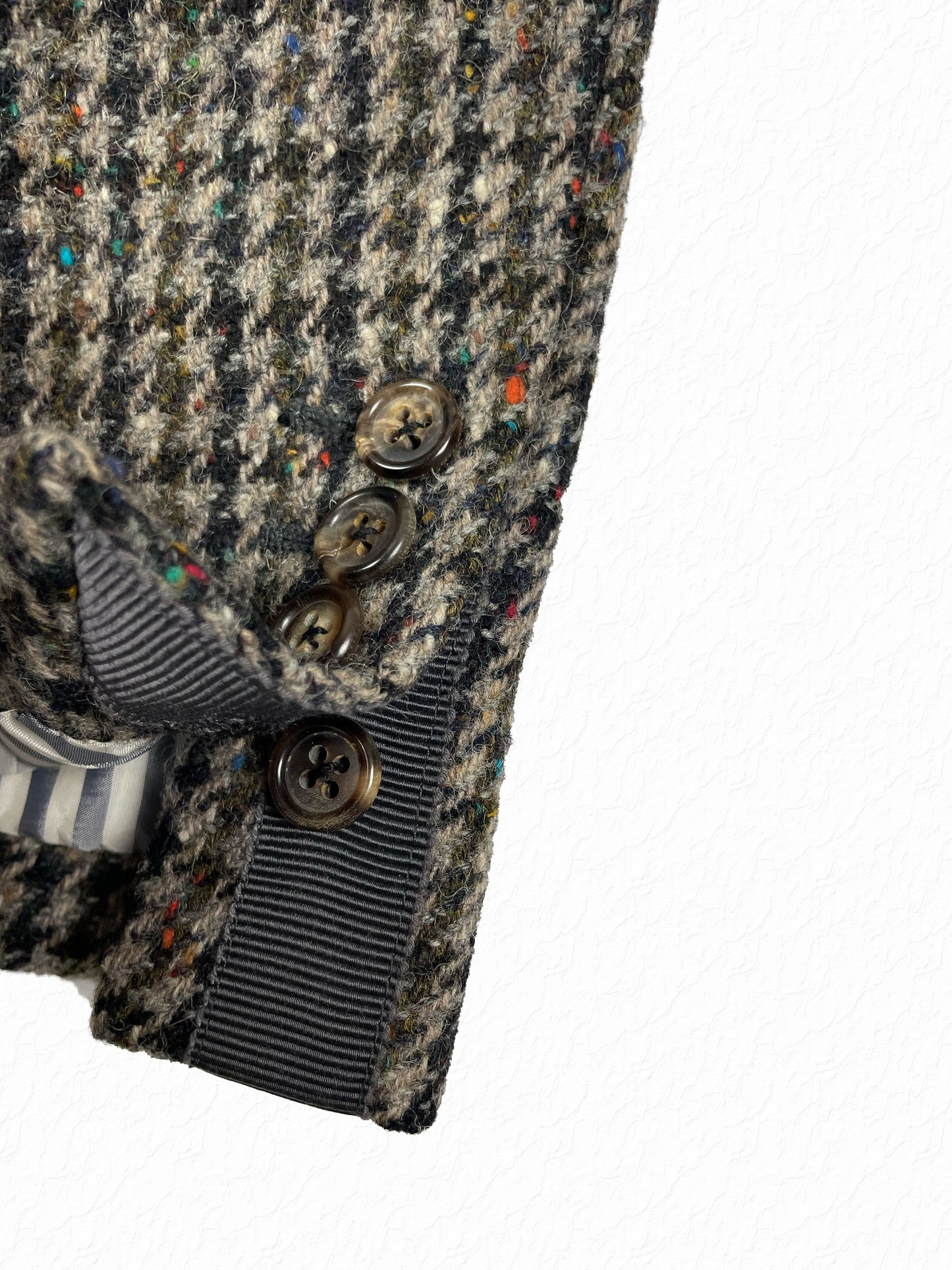 Thom Browne horn button sleeve cuff on grey tweed wool jacket