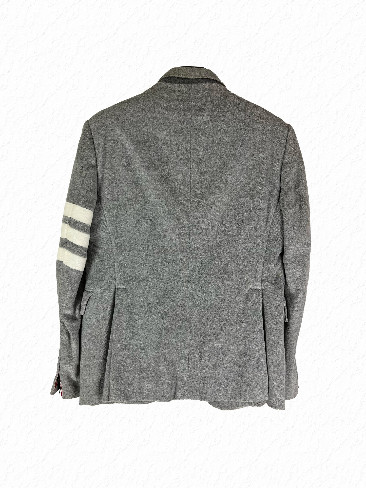 Grey terrycloth Thom Browne sport coat with notch lapel and two-button closure