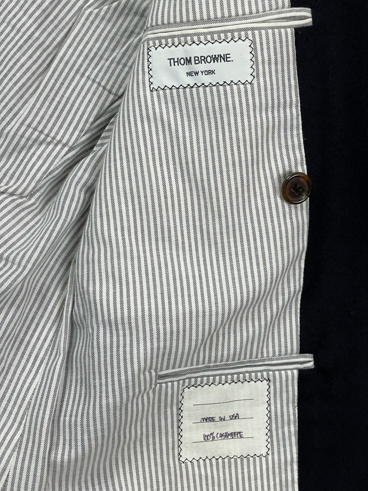 Red white blue grosgrain trim on Thom Browne cashmere blazer