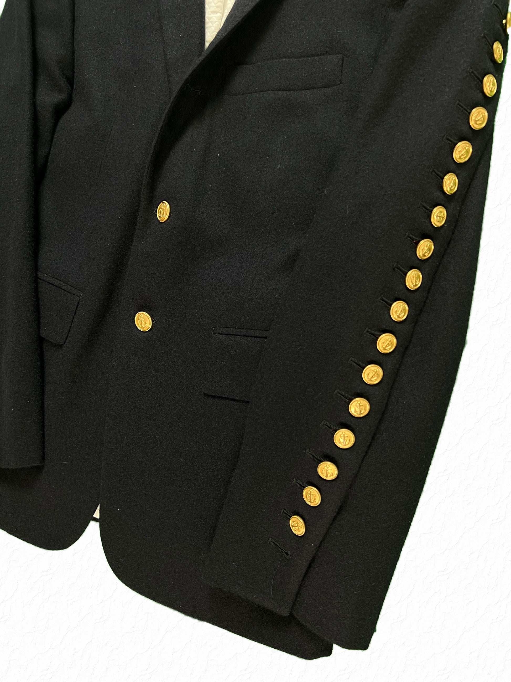Gold nautical anchor button arm fly on Thom Browne cashmere blazer