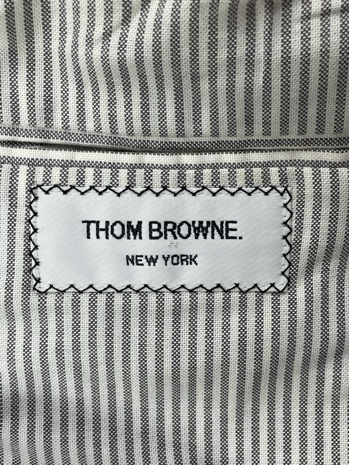Thom Browne New York woven label on grey striped lining tweed blazer