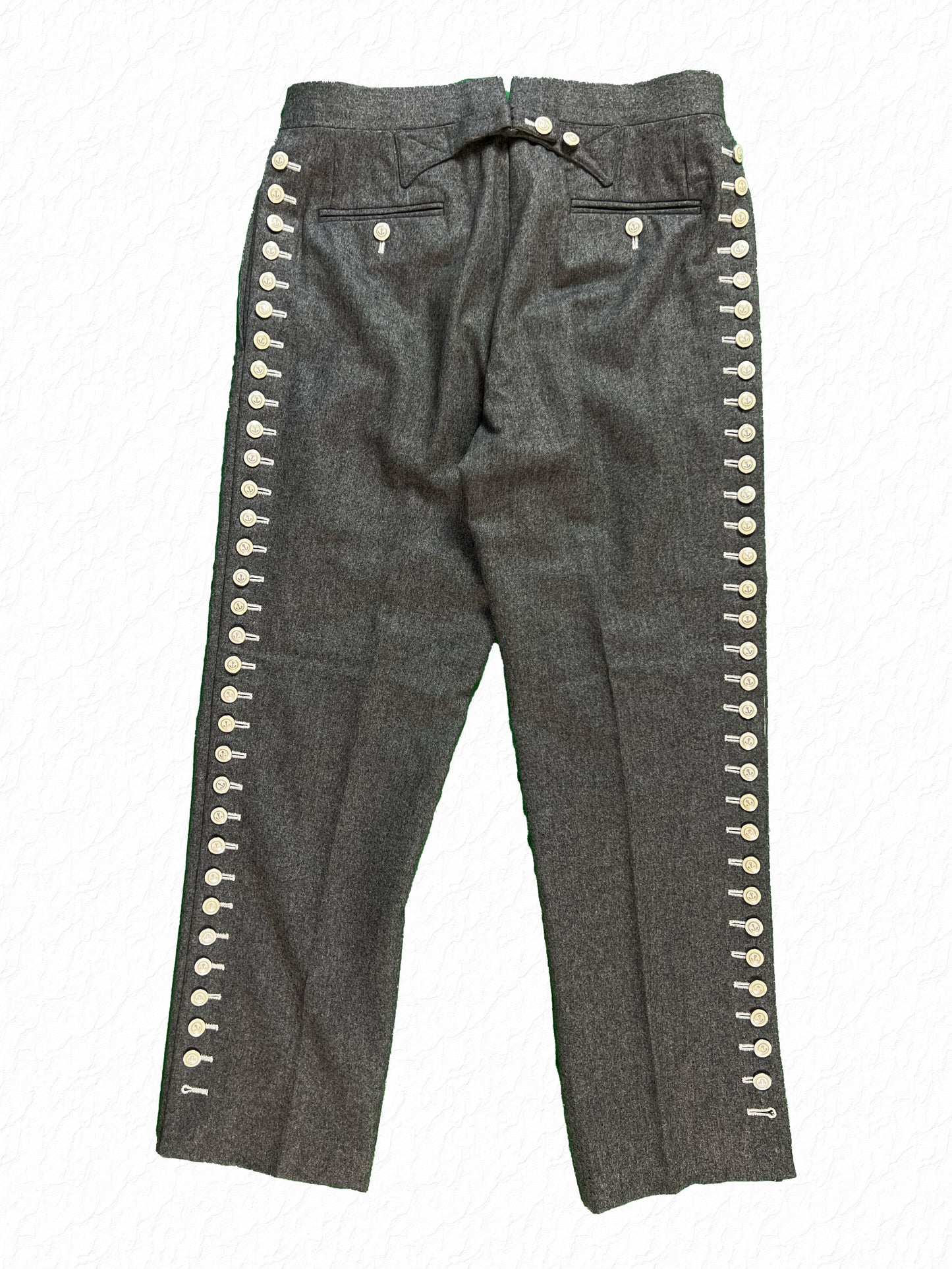 Grey wool flannel button leg trousers by Thom Browne