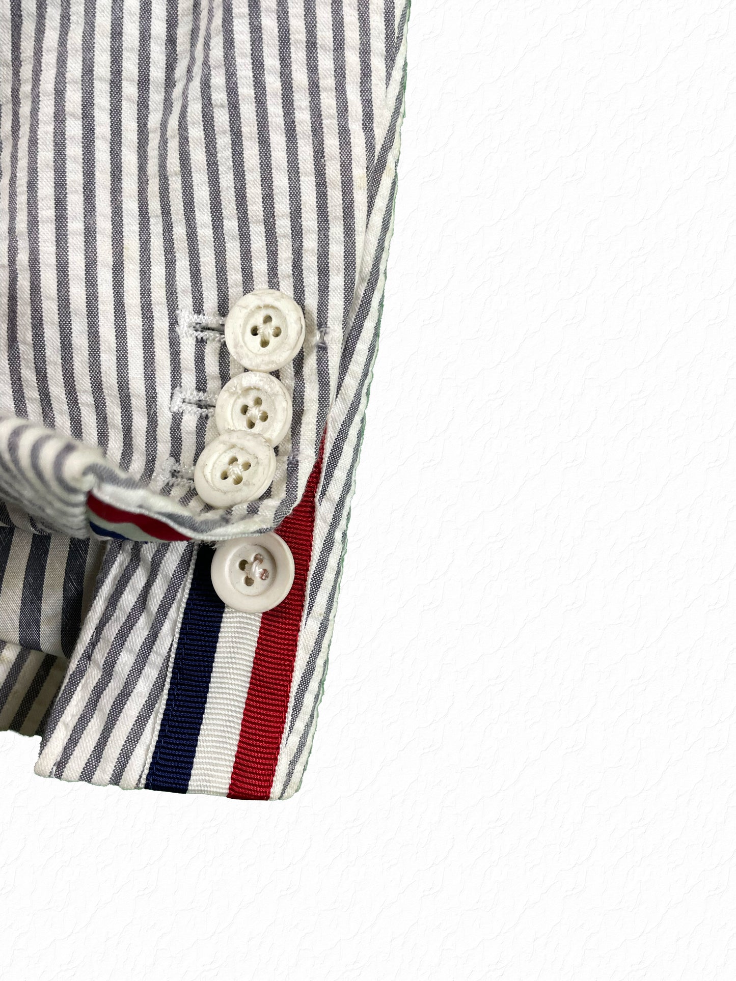 Thom Browne red white blue grosgrain tab with white rubber cuff buttons