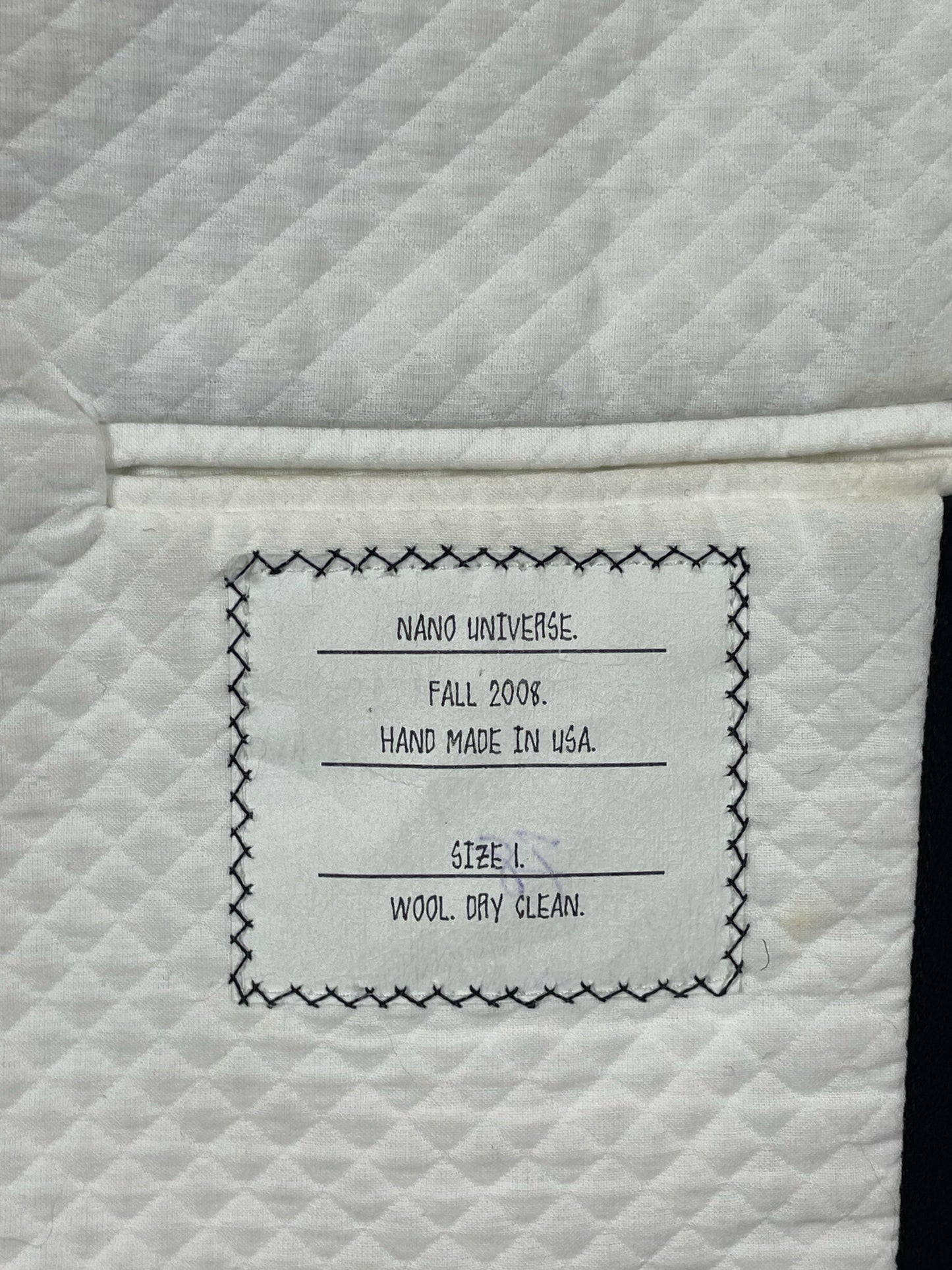 Nano Universe Fall 2008 handmade Thom Browne coat label