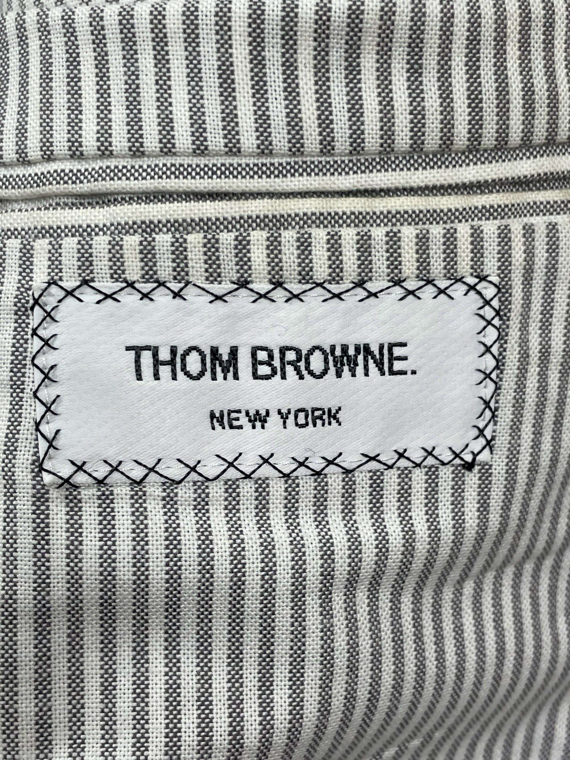 Grey striped cotton lining inside Thom Browne houndstooth wool overcoat