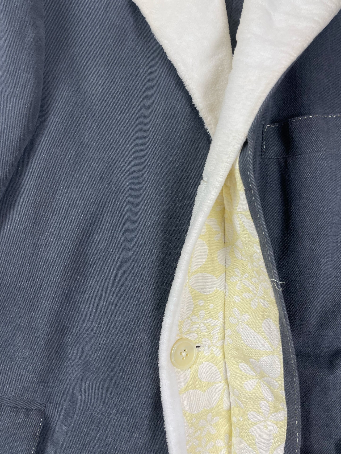 Grey corded cotton Chesterfield coat by Thom Browne with pastel yellow floral lining