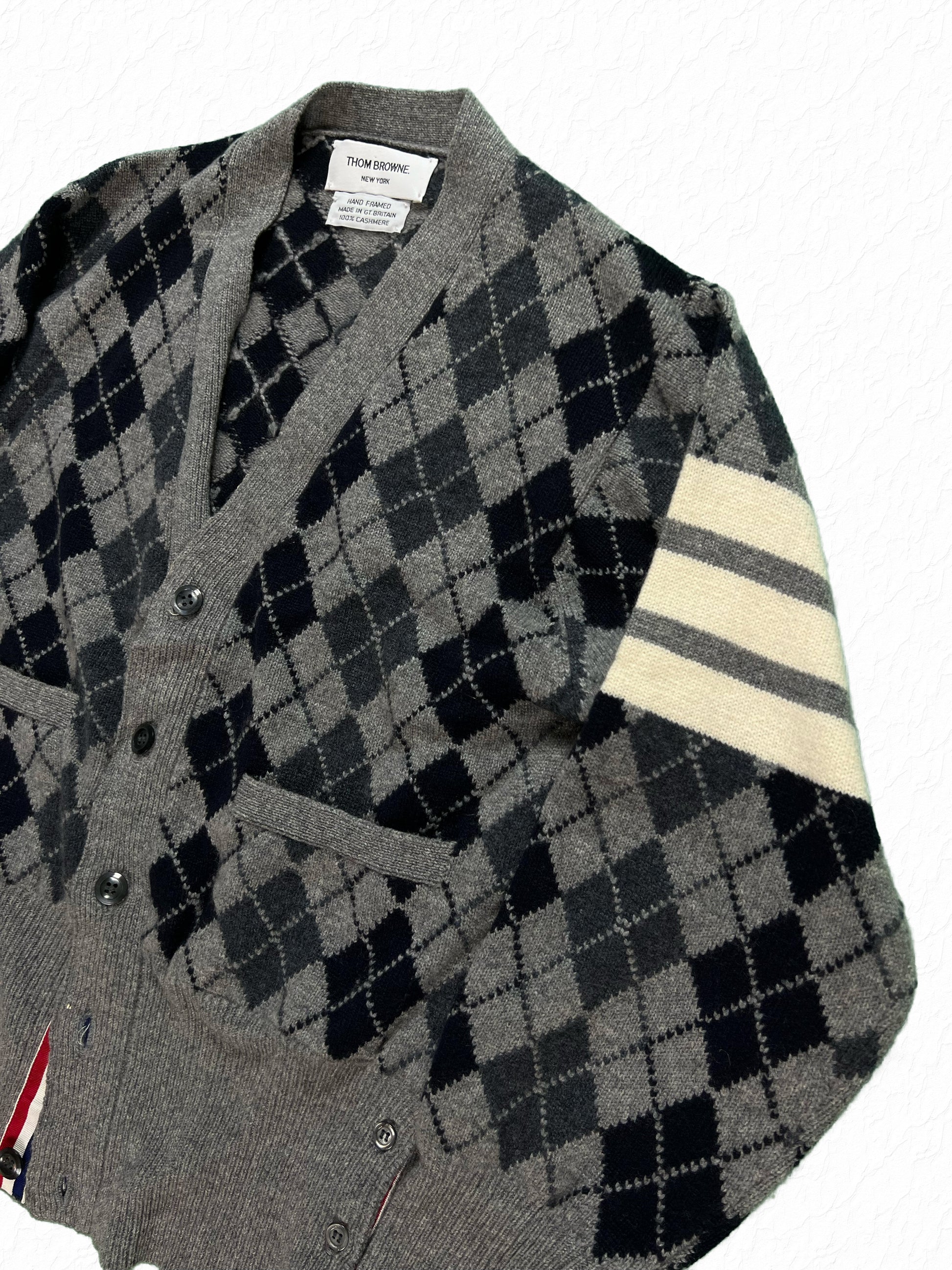 Argyle knit cashmere cardigan by Thom Browne in grey and navy