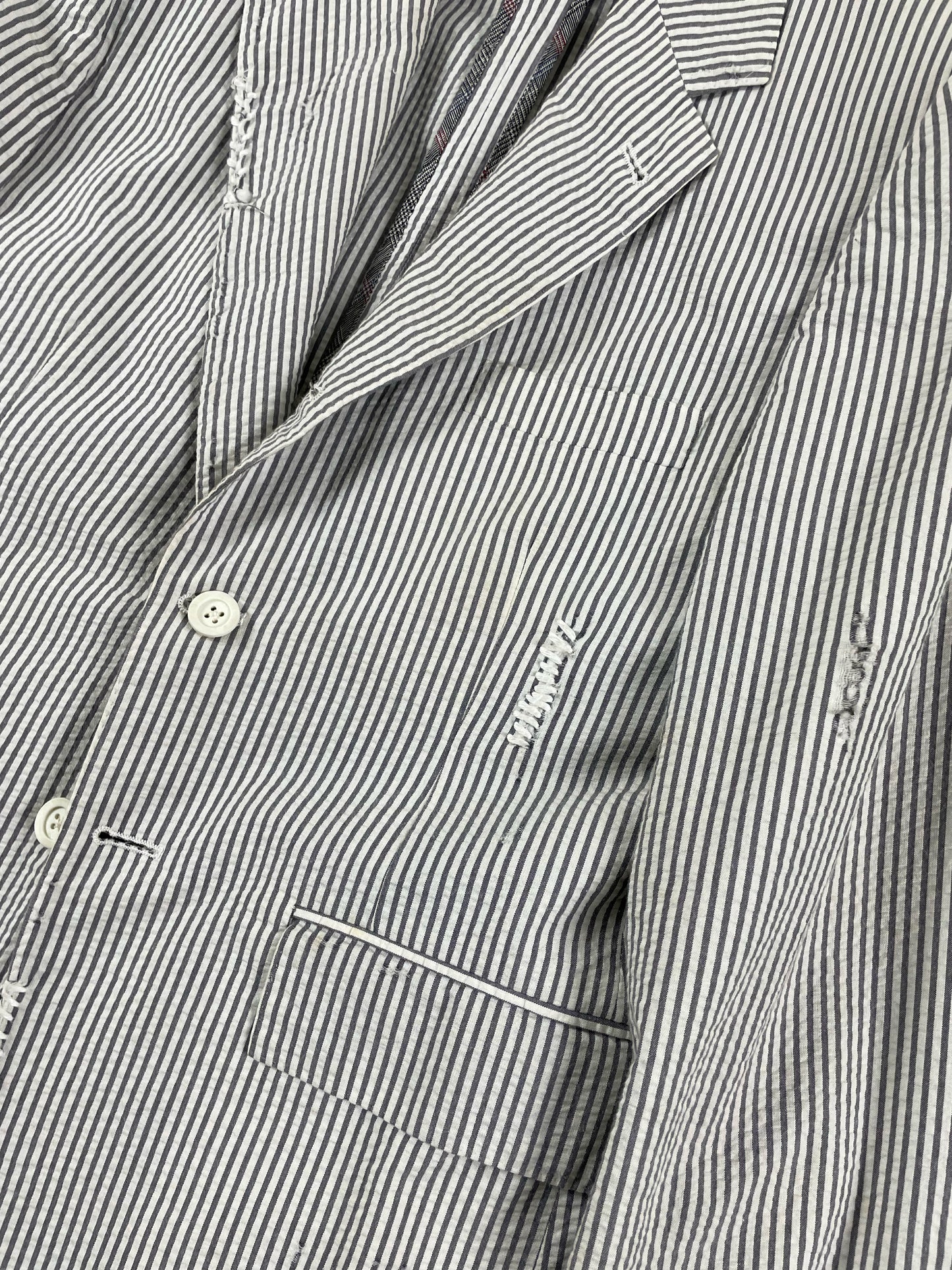 Distressed seersucker Thom Browne blazer with notch lapel and frayed edges