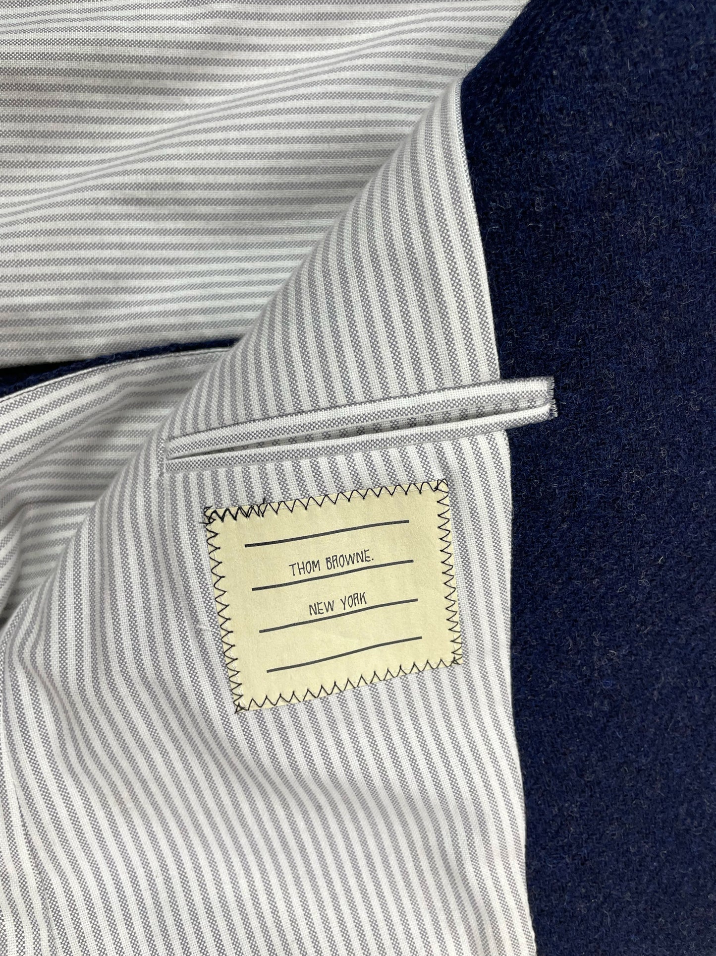 Thom Browne New York striped cotton lining on navy tweed jacket