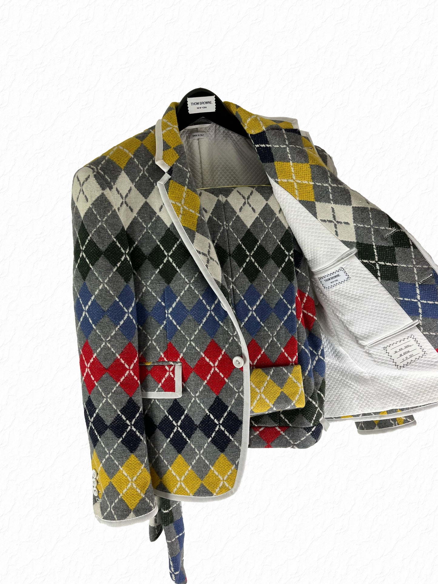Multicolor argyle knit blazer by Thom Browne in grey red blue and yellow