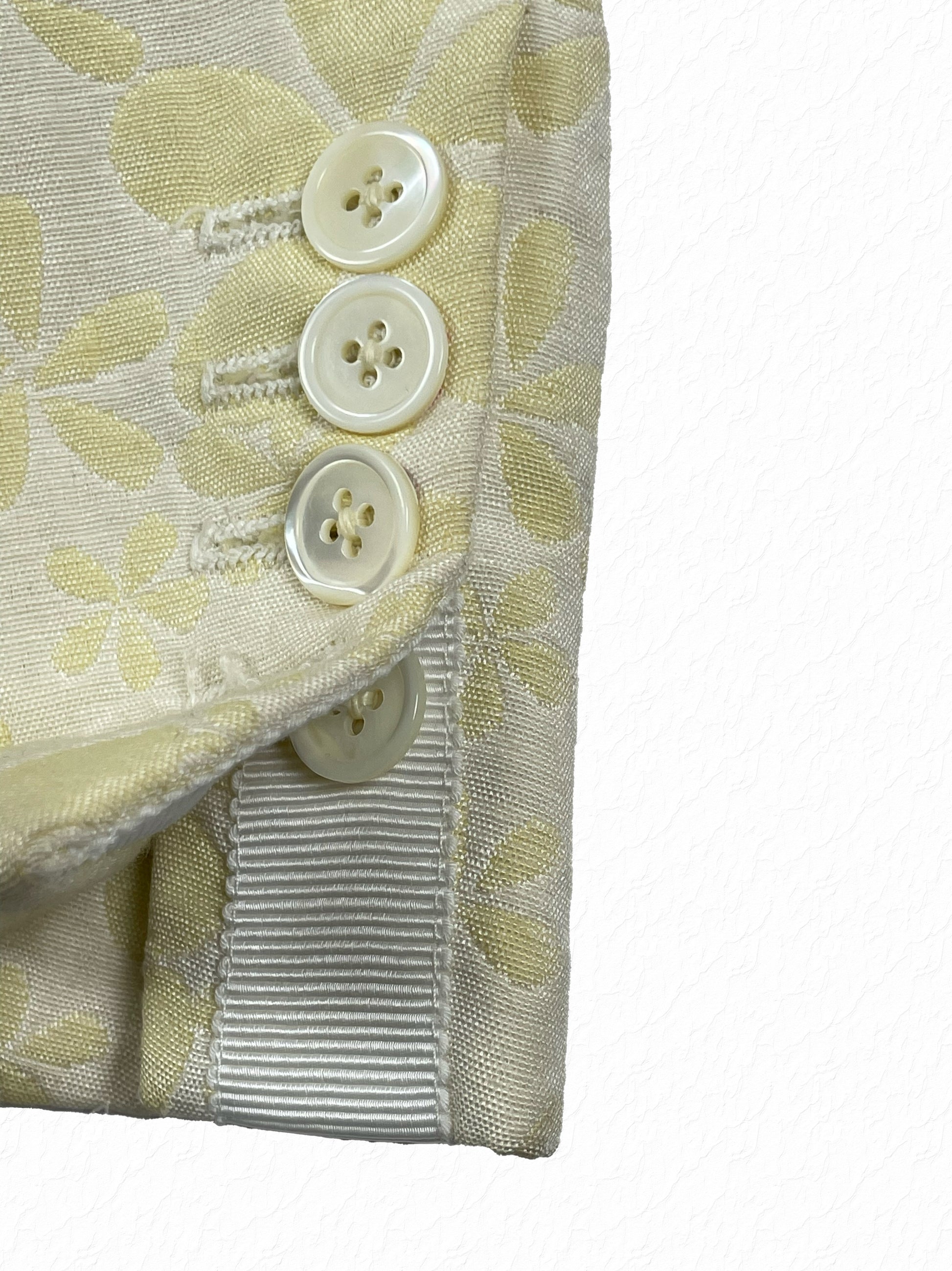 Mother of pearl buttons on Thom Browne floral jacquard cuff