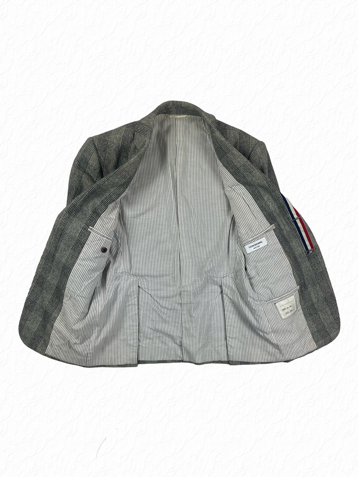 Grey striped cotton lining in Thom Browne glen plaid cardigan jacket