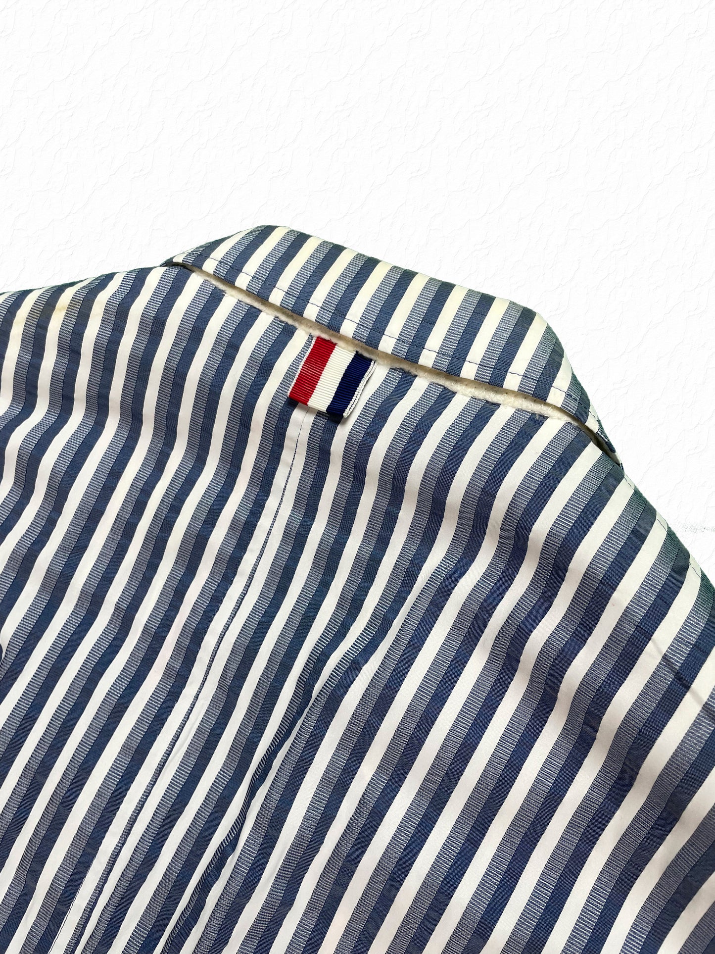 Thom Browne sack jacket cuff with red white blue grosgrain buttons
