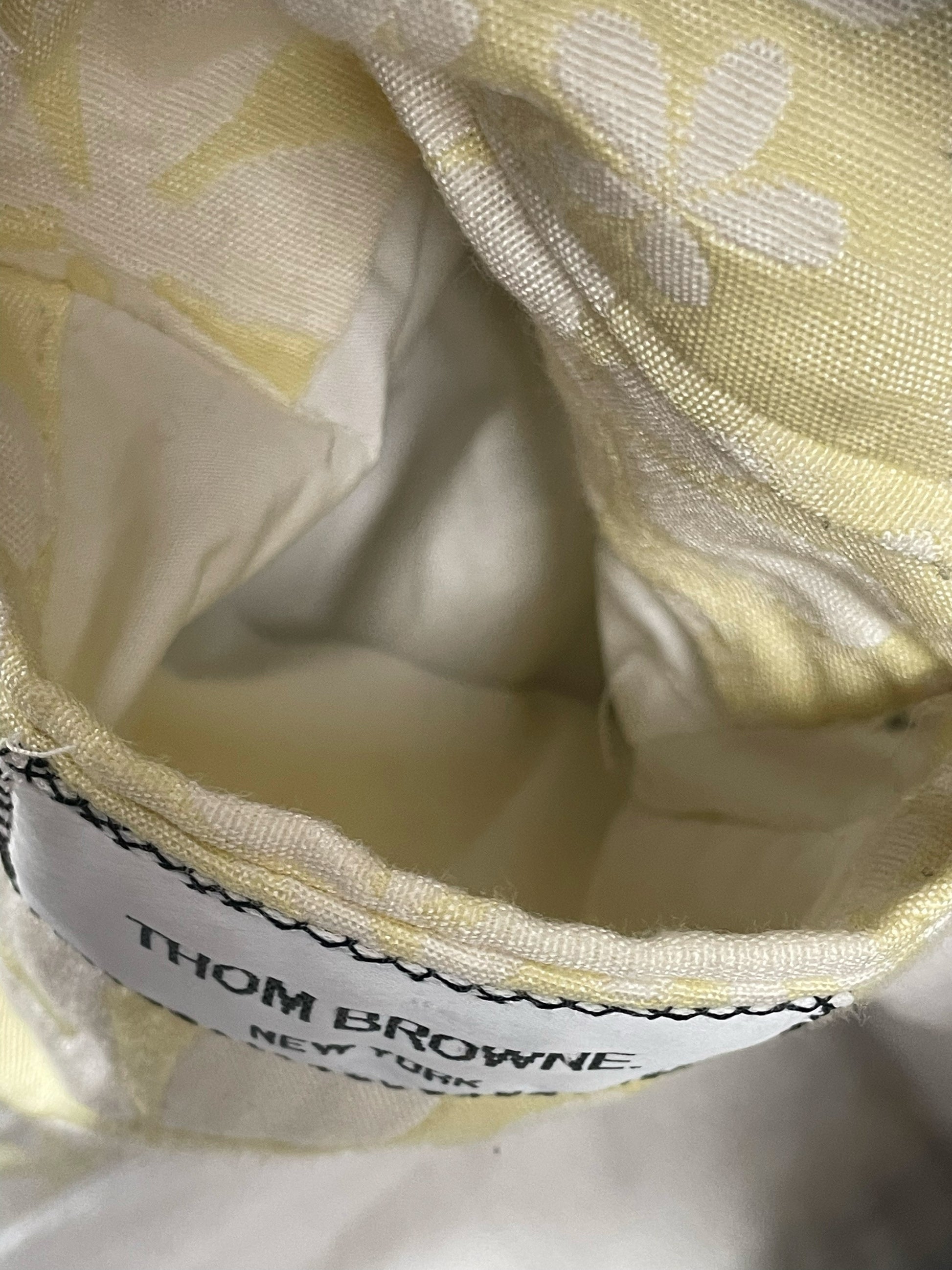 Toweling collar and grey corded cotton construction on Thom Browne Chesterfield coat