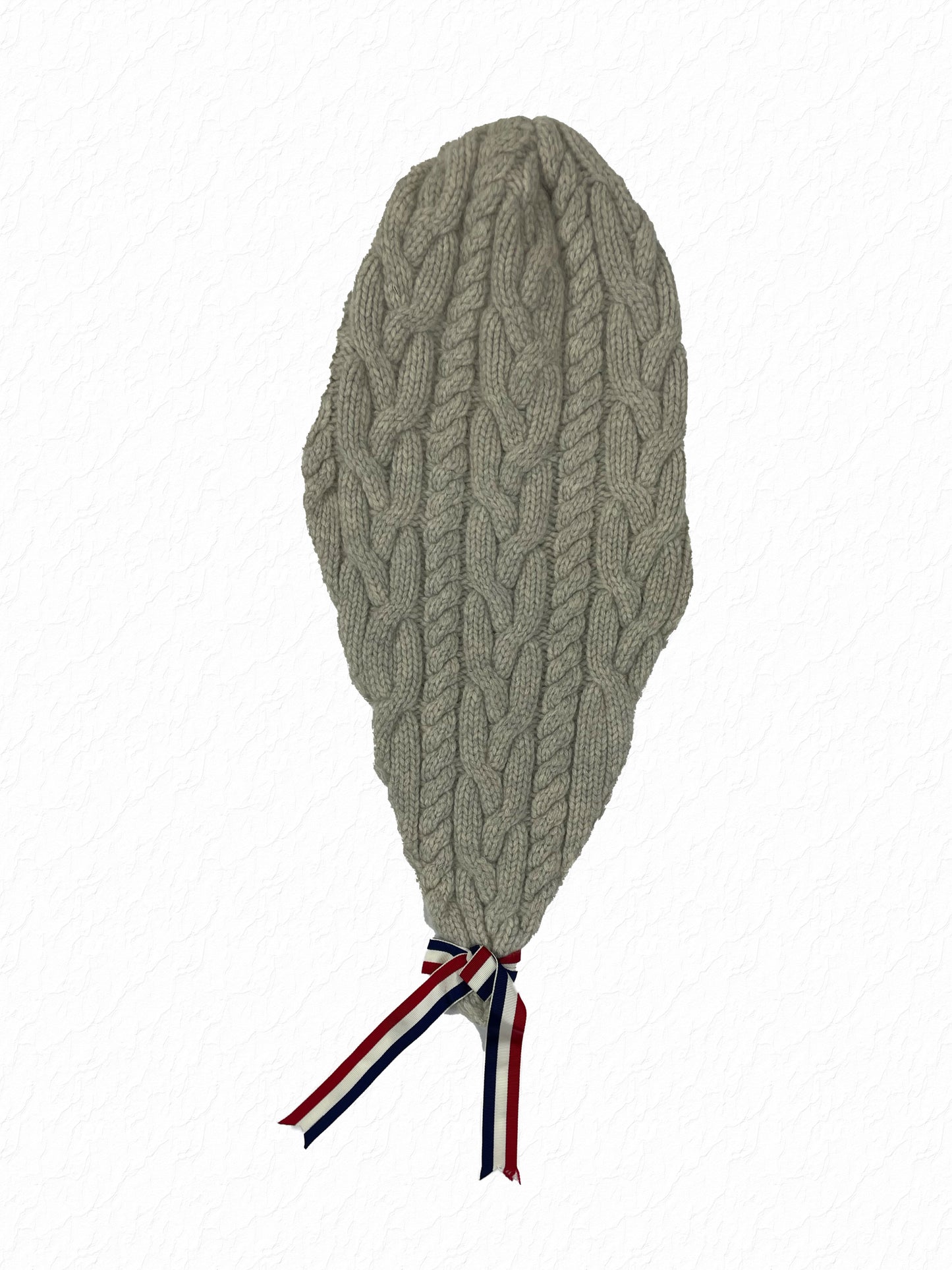 Red white and blue grosgrain ribbon knot tail on Thom Browne knit cap