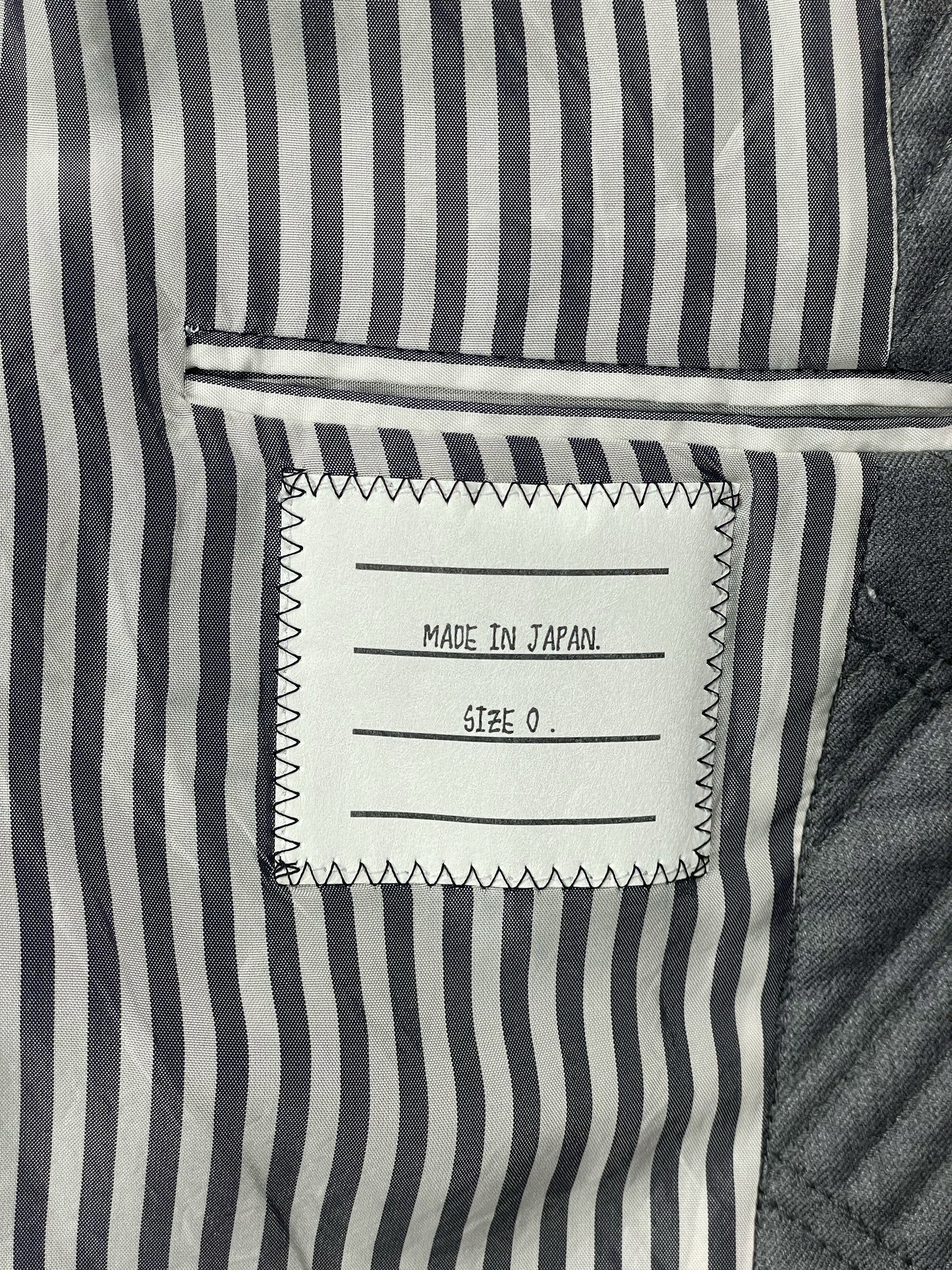 Striped cupro lining inside Thom Browne quilted grey sport coat