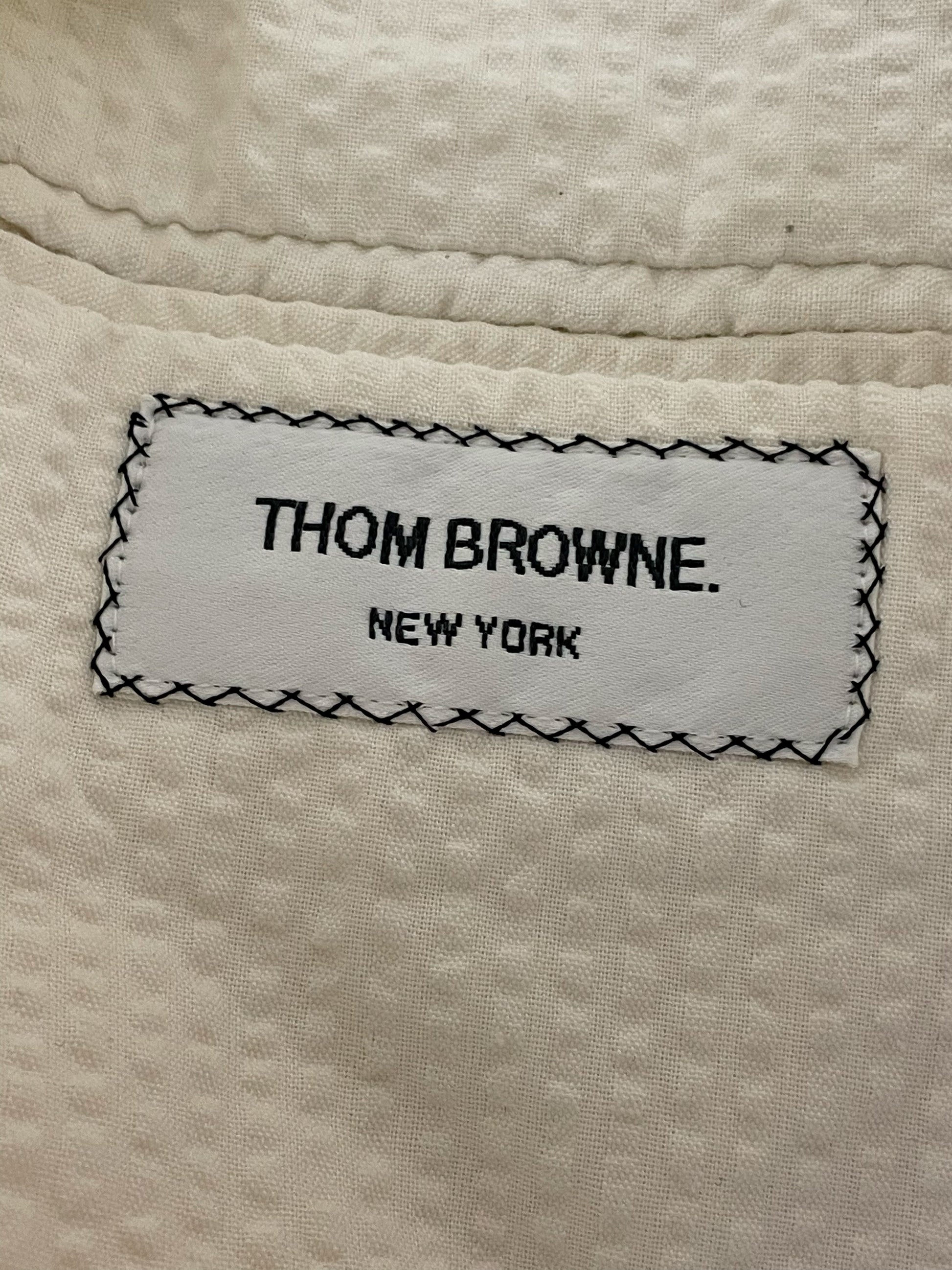 Thom Browne New York label on white Swiss dot cotton sport coat
