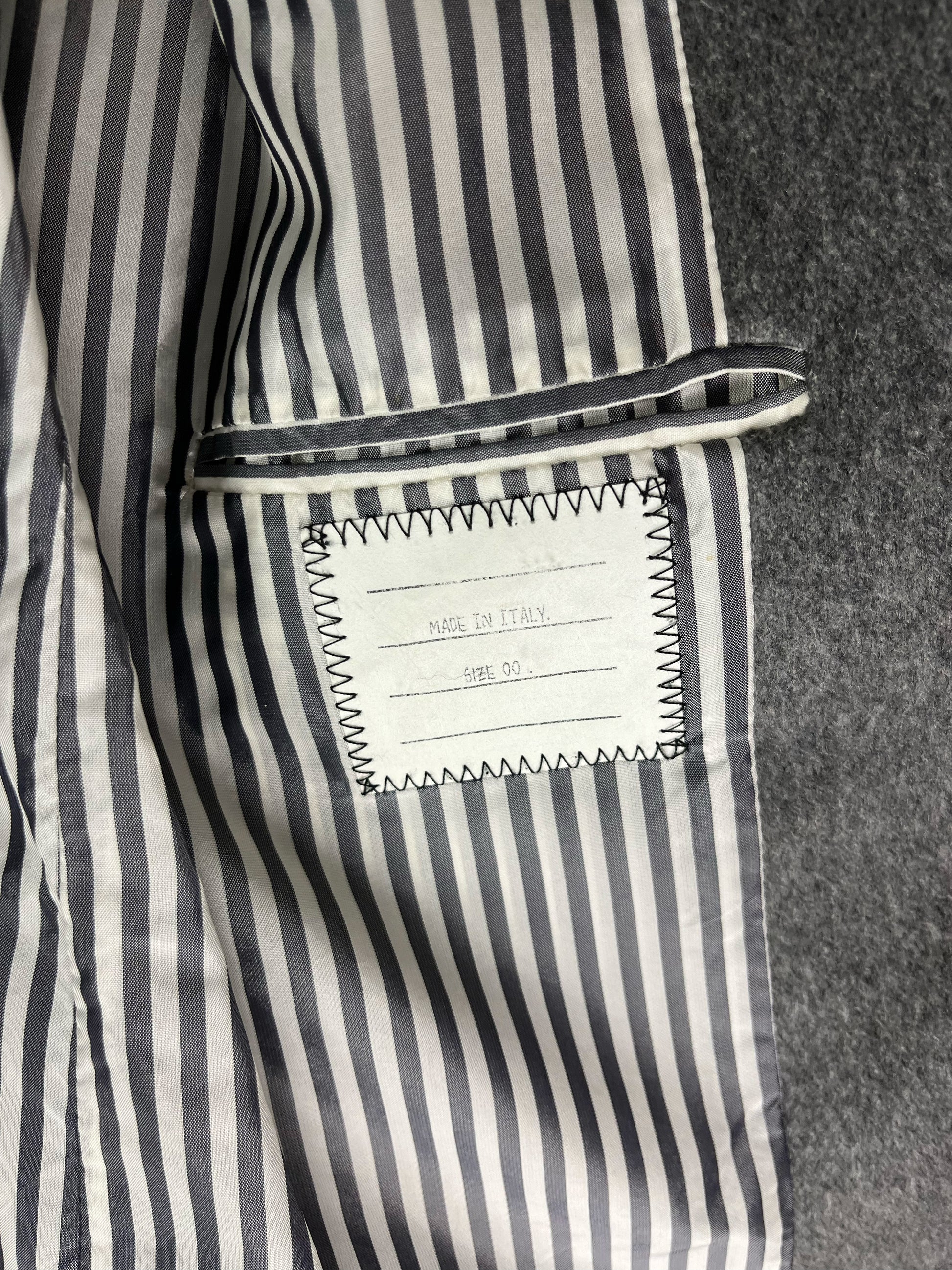Grey striped internal lining on archival Thom Browne wool coat