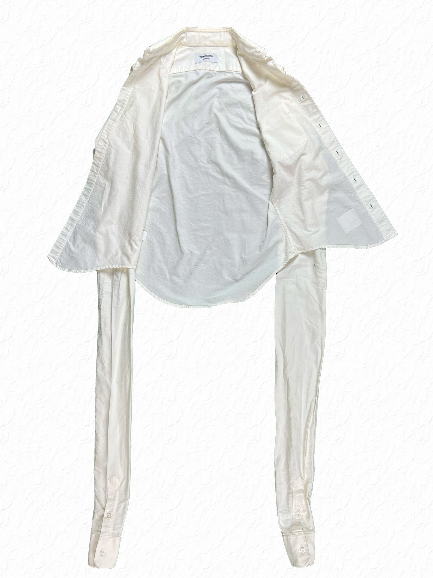 White cotton oxford shirt with buttoned cuffs by Thom Browne