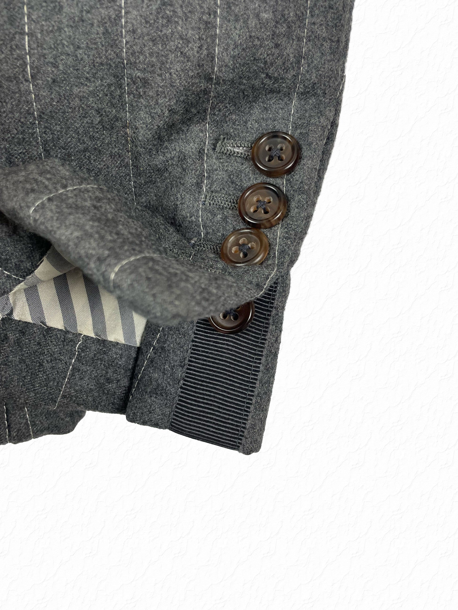 Gray flannel sport coat with chalk pinstripes by Thom Browne