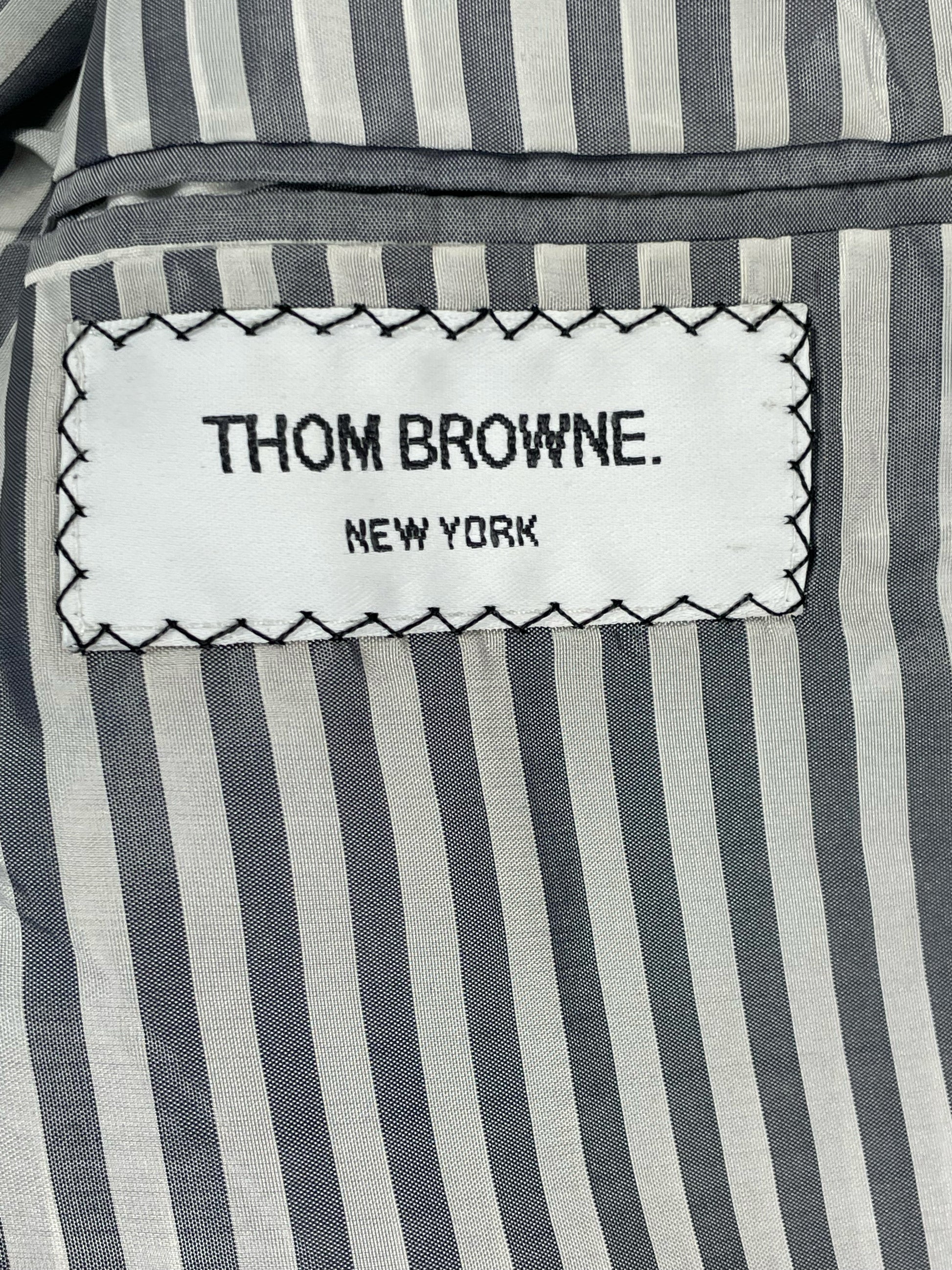 Thom Browne New York woven brand label on striped lining