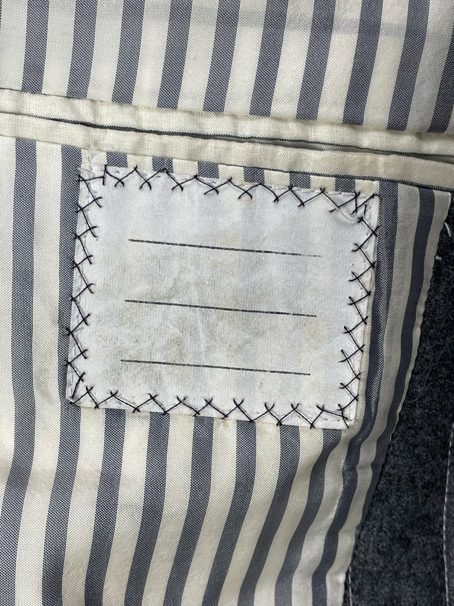 Striped grosgrain trim on Thom Browne Fall 2005 sport coat