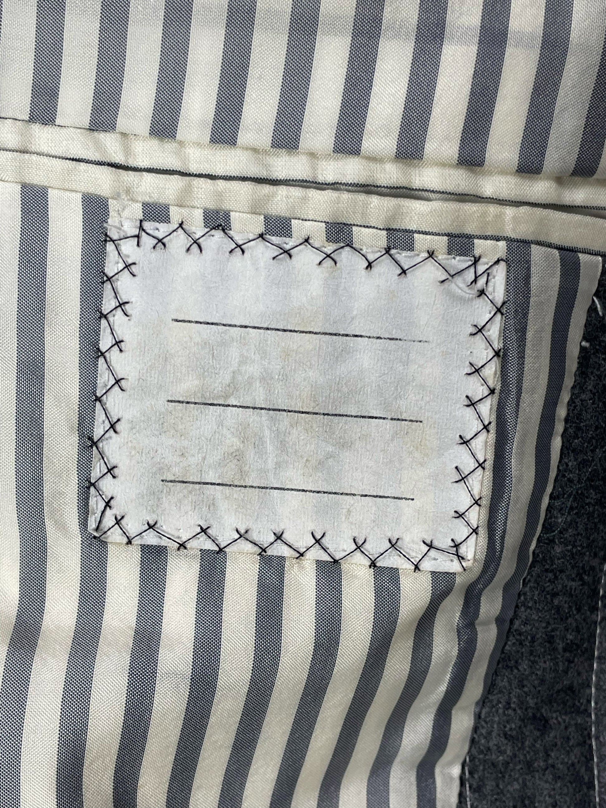 Striped grosgrain trim on Thom Browne Fall 2005 sport coat