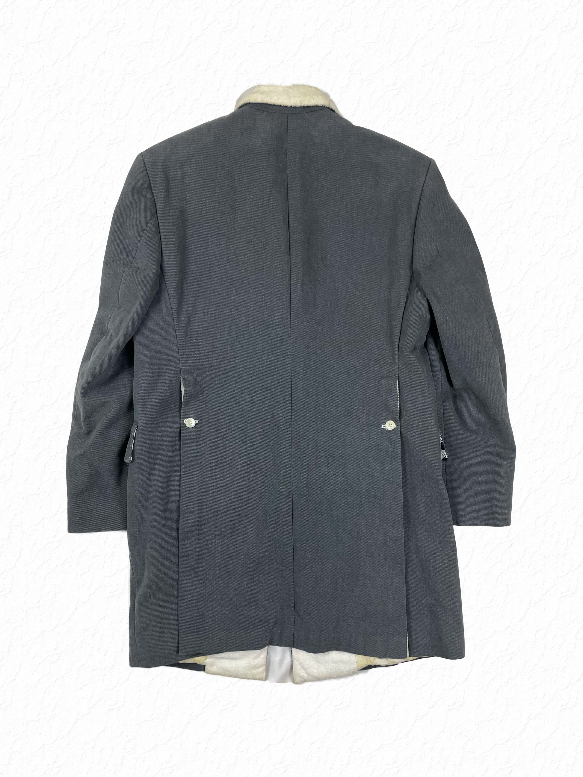 Corded cotton Chesterfield silhouette by Thom Browne with clean grey twill body