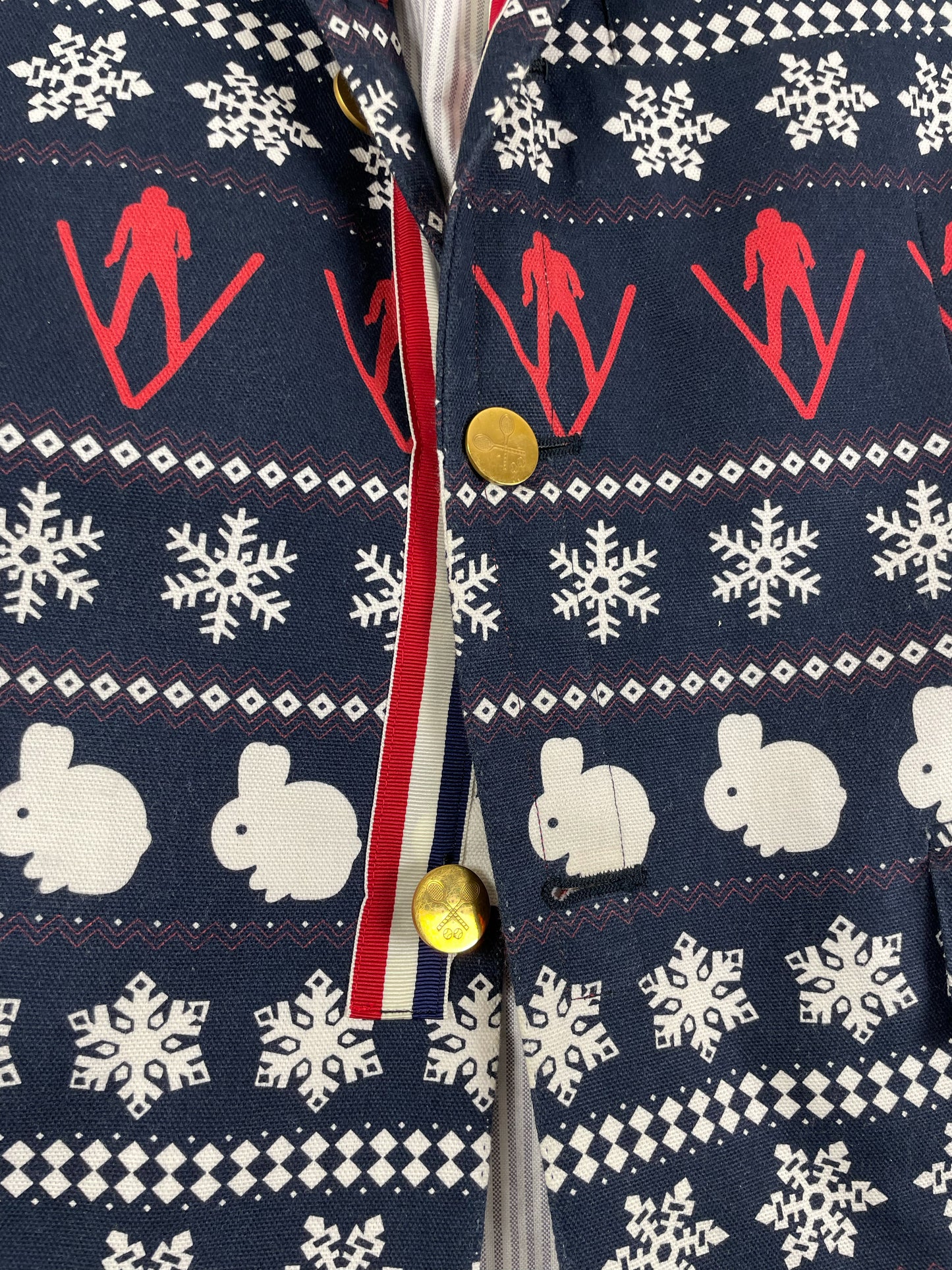 Red white blue grosgrain placket on Thom Browne ski print blazer