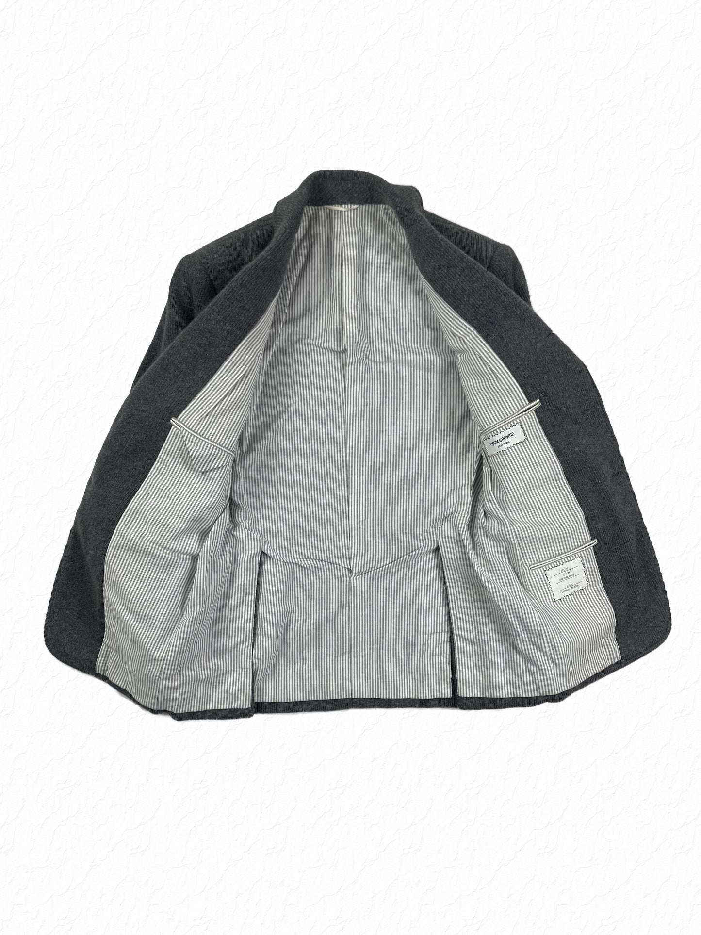 Grey striped cotton lining inside Thom Browne cashmere jacket